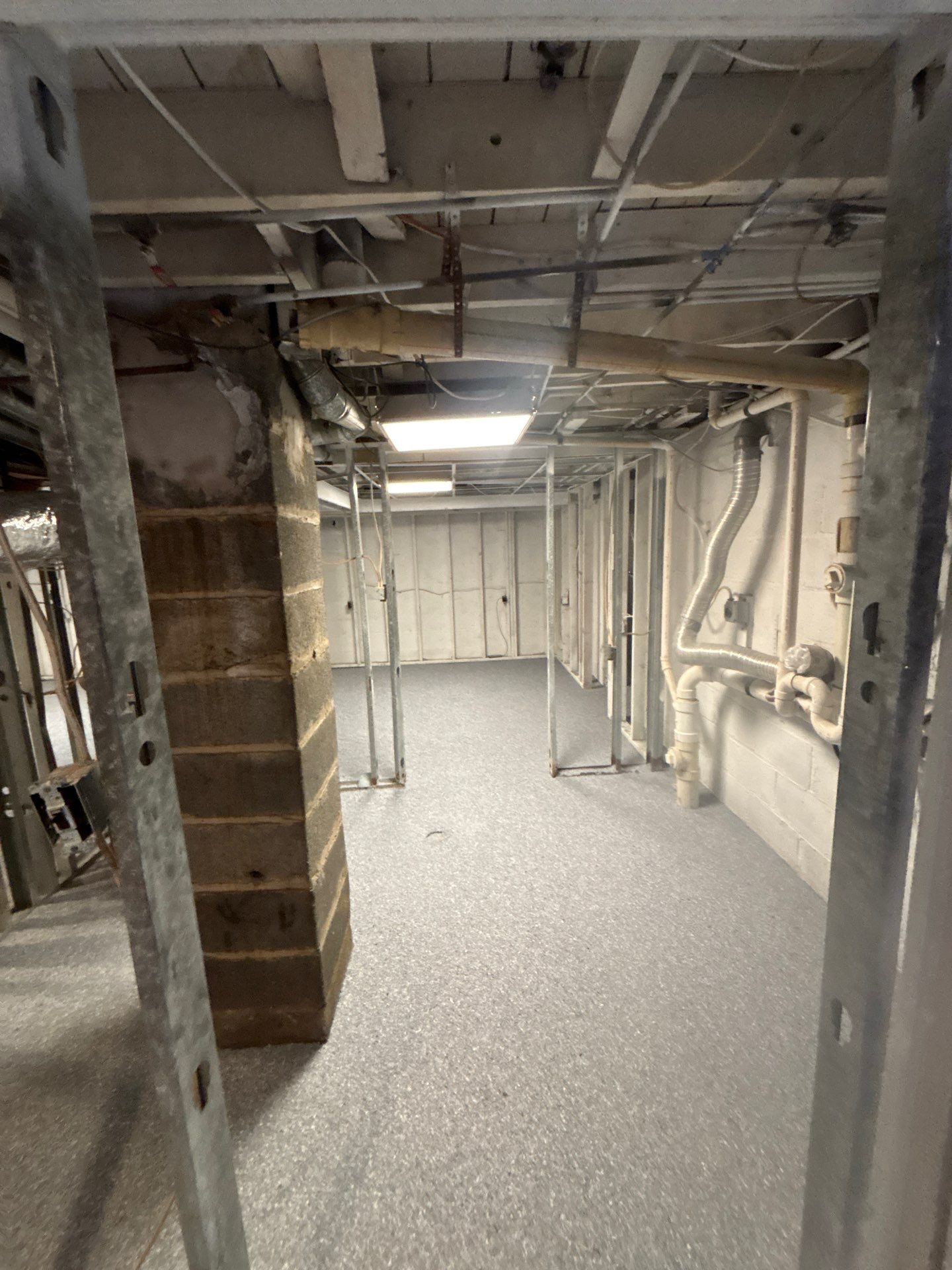 Basement Concrete Floor Coating with Penntek Flake System by Spectrum Painting, LLC