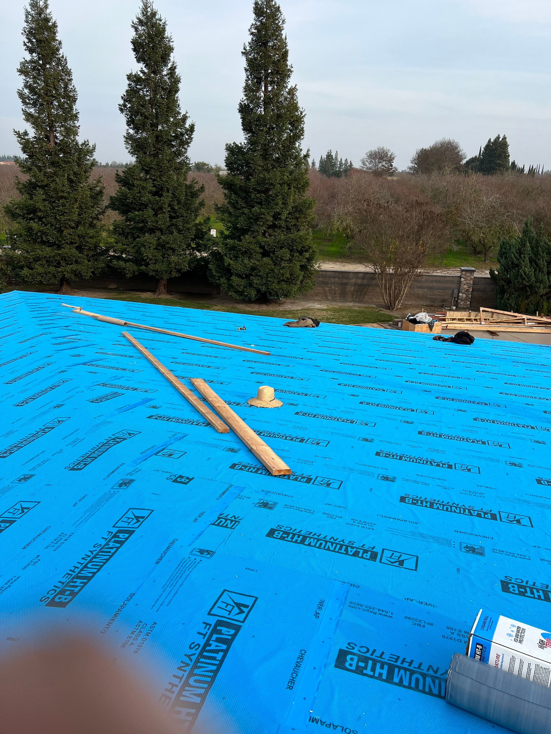 Tile, Metal, and TPO roofing project (new construction) by Straight Edge Roofing Inc