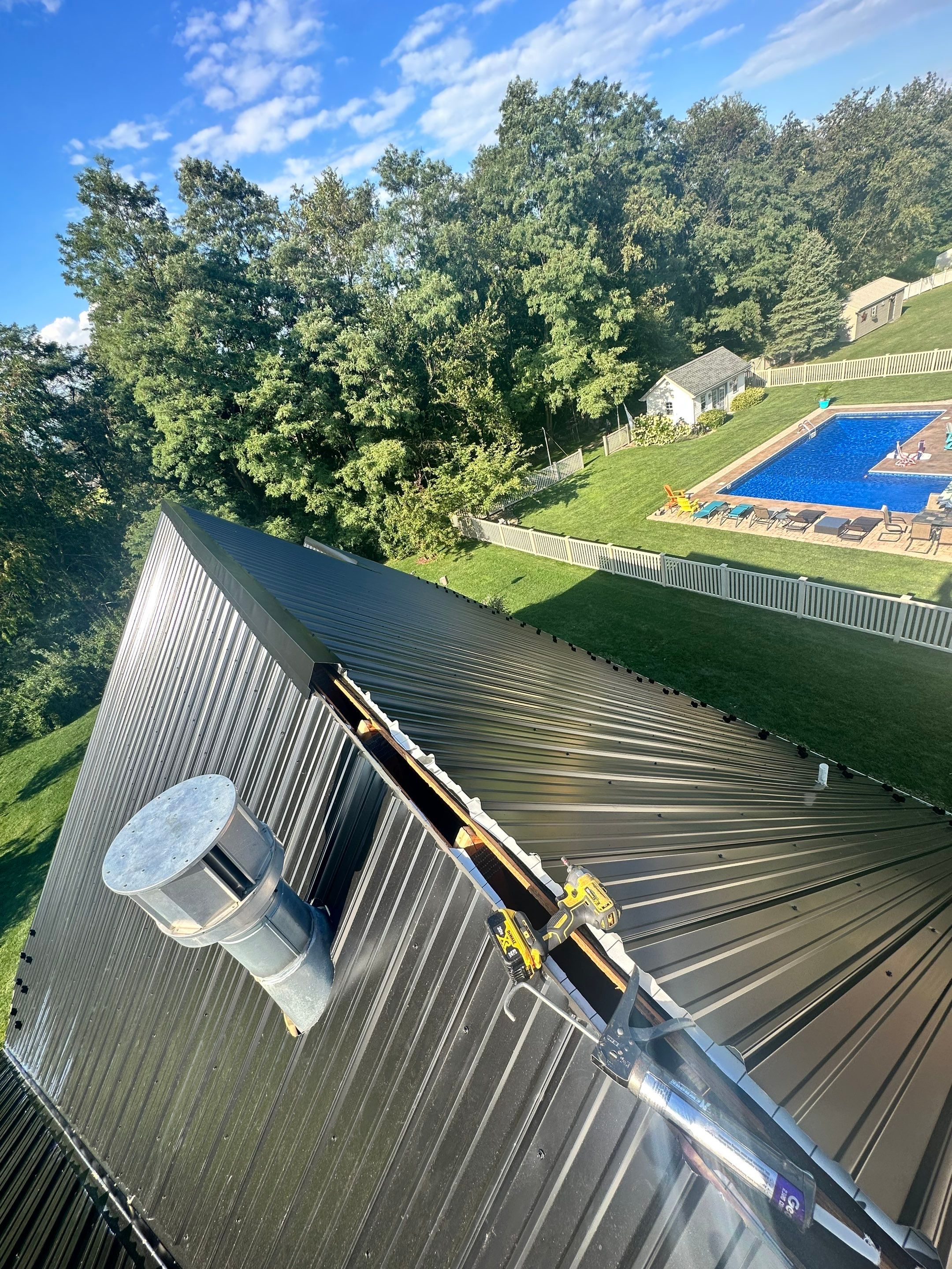 Standing seam / Azm panel in black  by Teflon Roofing