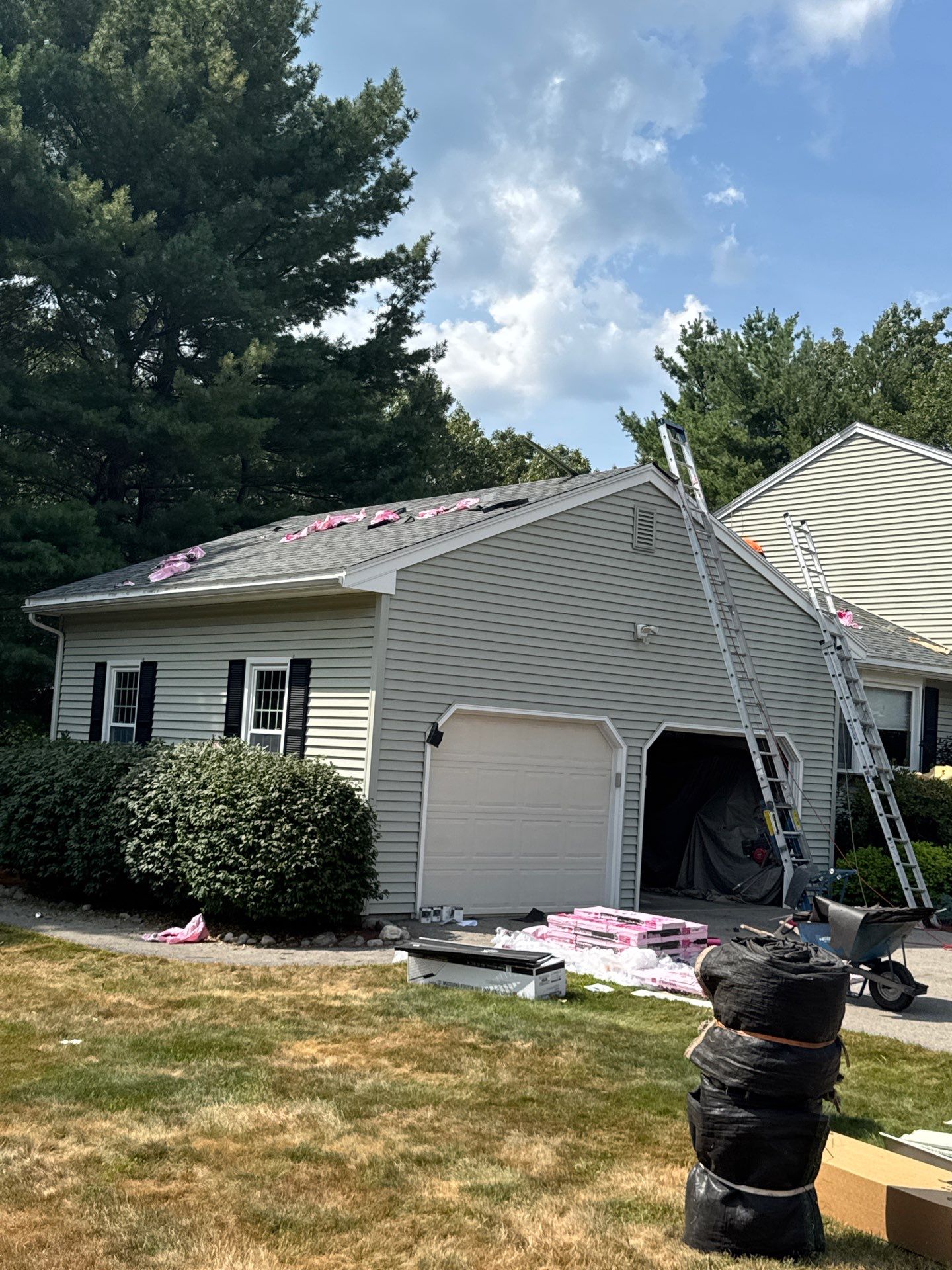 Complete Roof Replacement with Chimney Flashing, Gutter Guard System, and Vinyl Siding Repairs by Mighty Dog Roofing of Greater Middlesex County