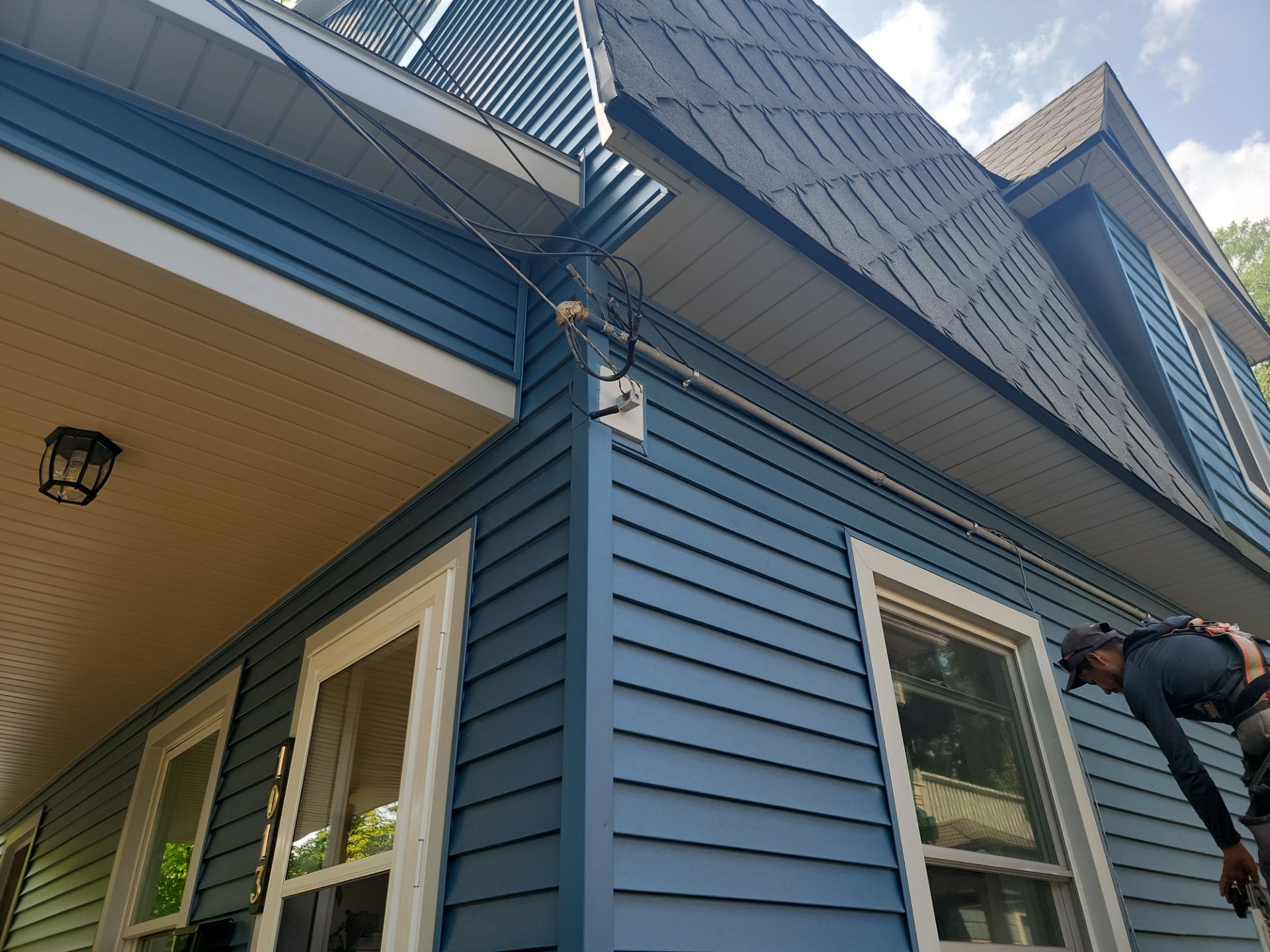 SIDING, DECK AND NEW PORCH  by Avalon Roofing and Exteriors