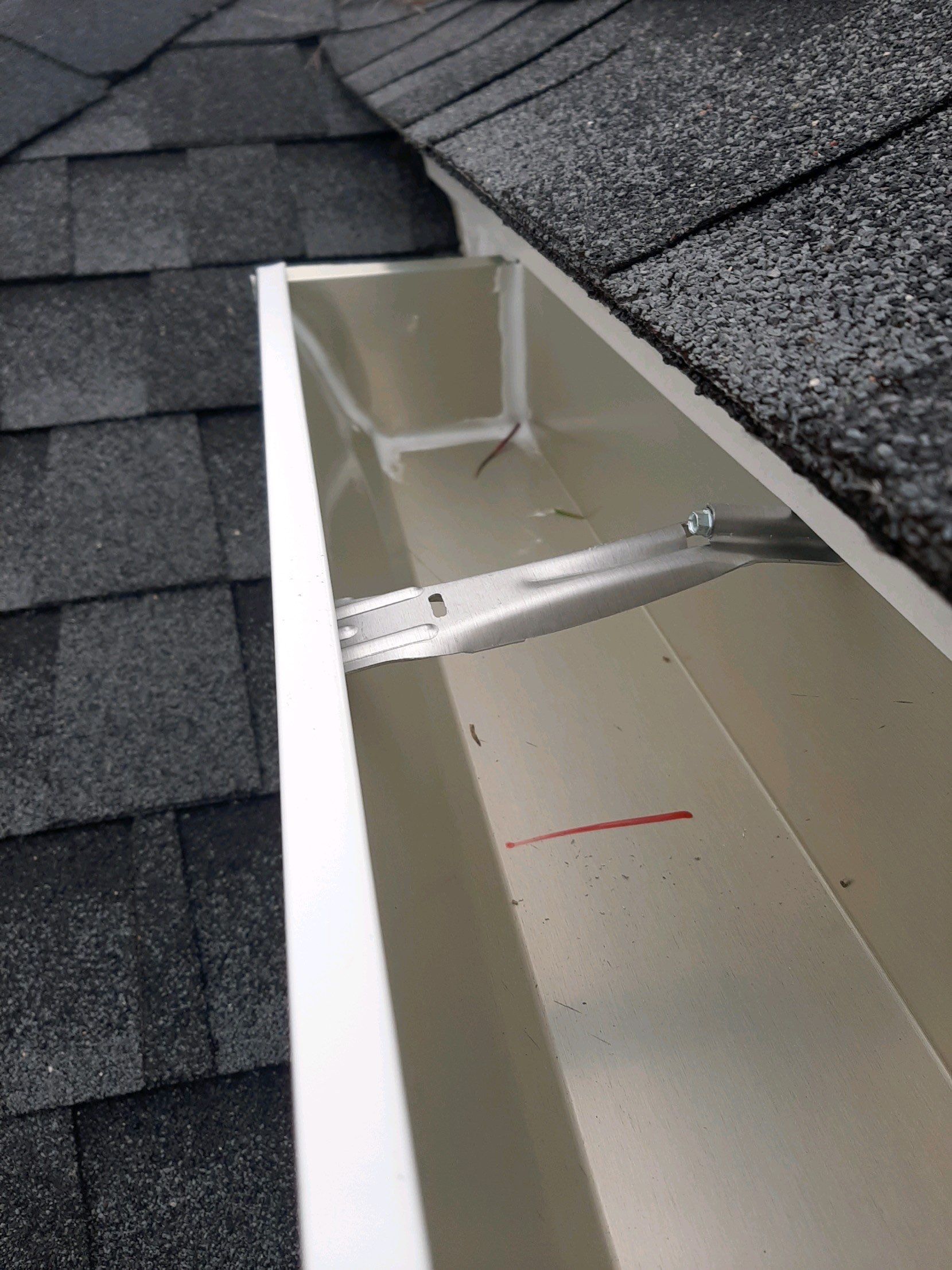 Gutter Installation using White K-Style Seamless Gutters by Gutter Professors