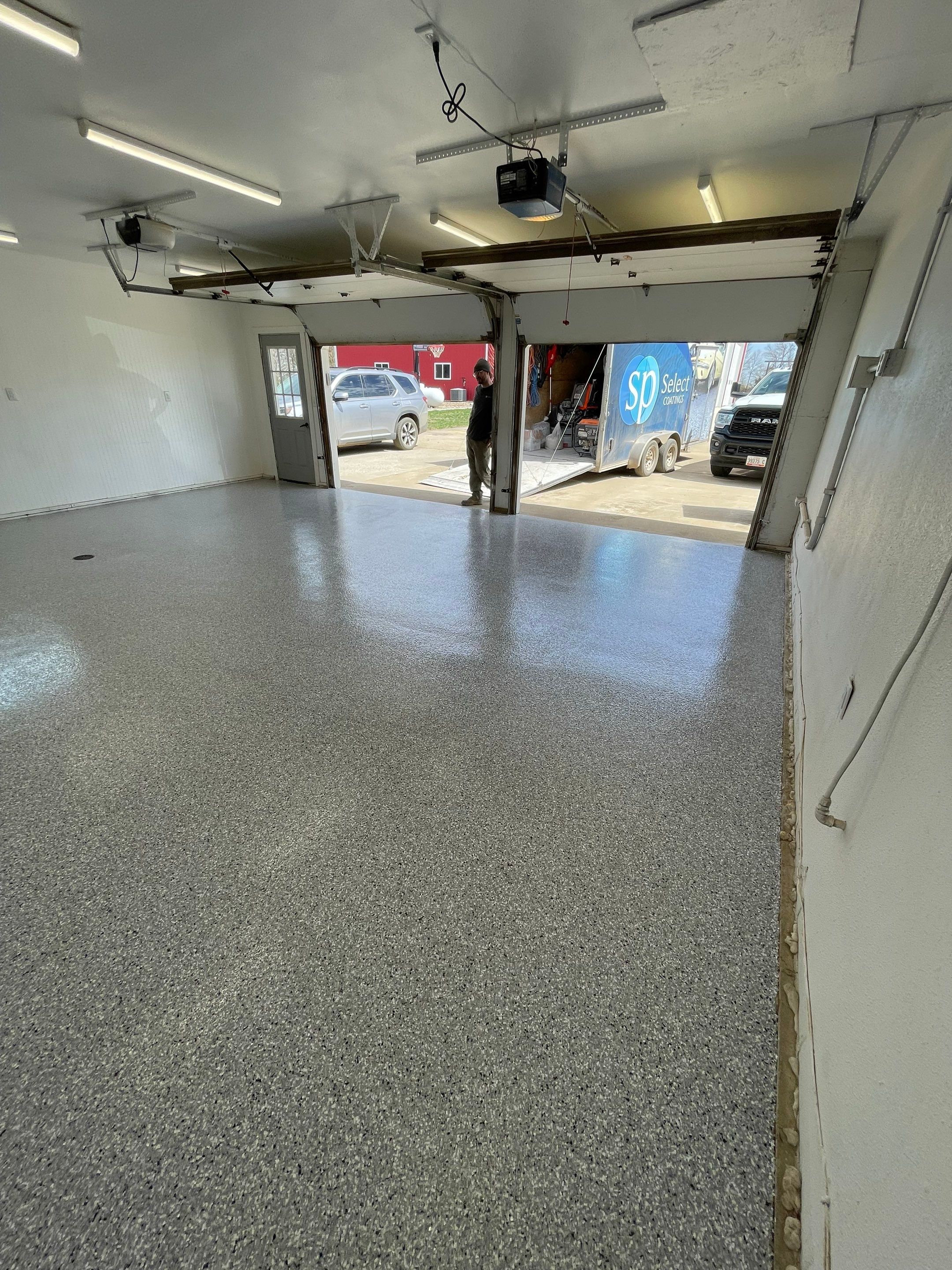 Feather Grey Garage Floor Coating and Crack Repair in Beresford by Select Painting, Coatings & Garage Cabinets