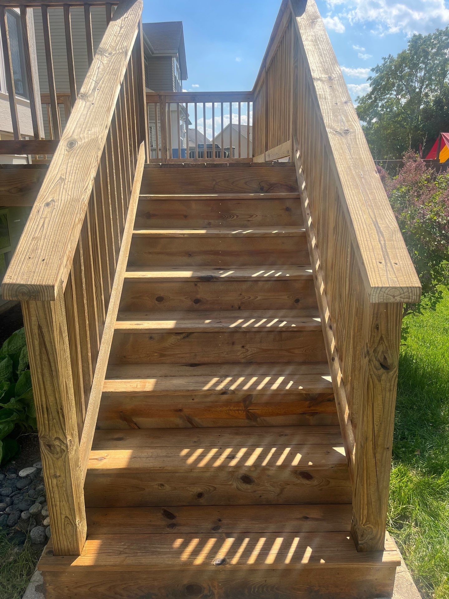 wood deck cleaning and staining by Northern Power Washing LLC.