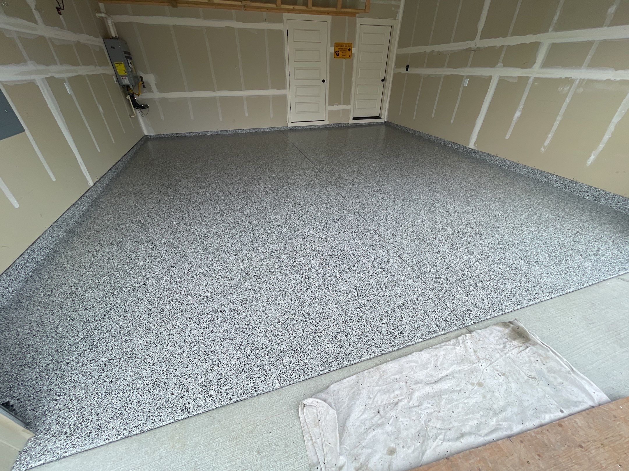 Garage Transformation using Domino by Croc Coatings, LLC