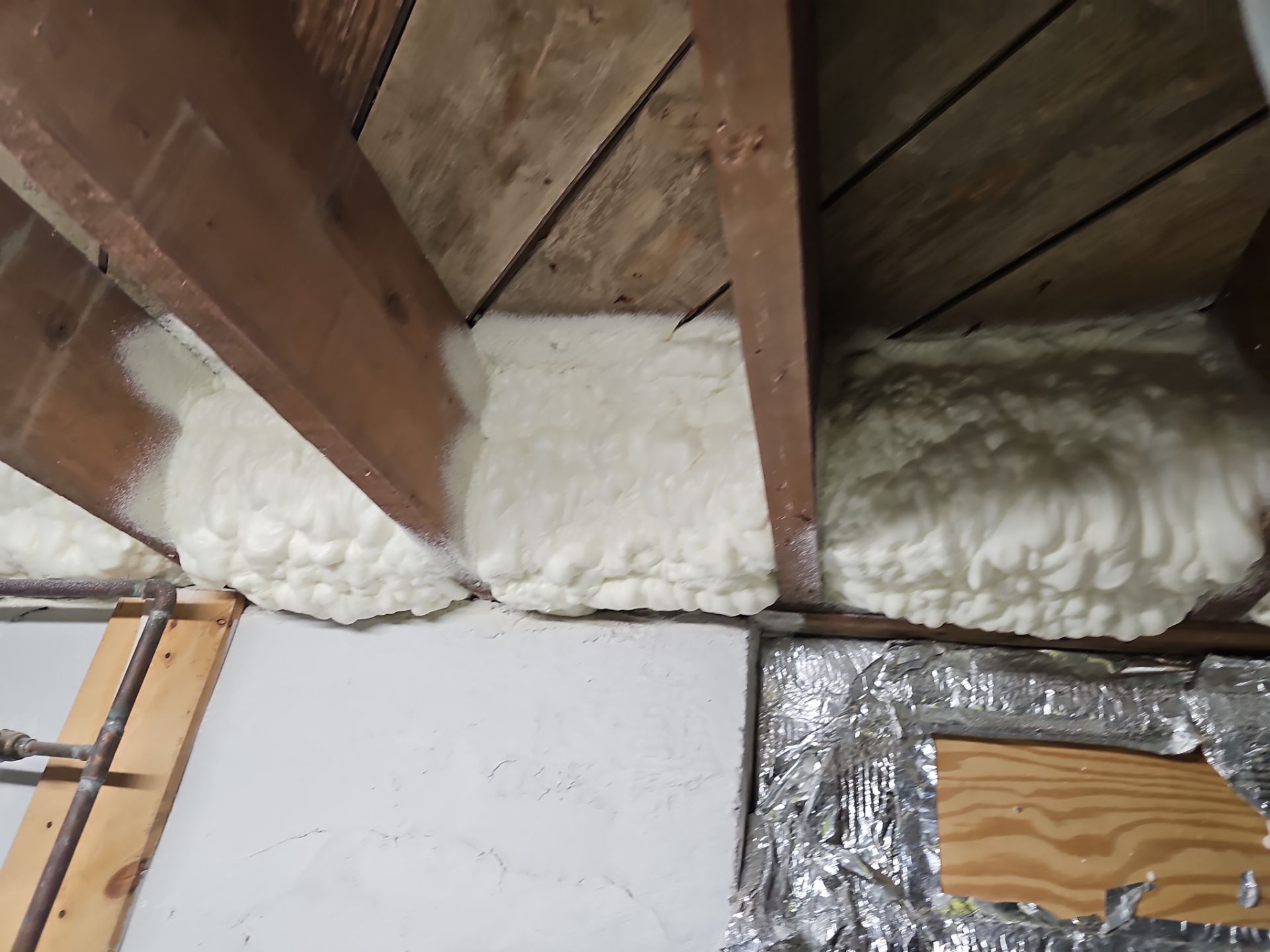 Attic Insulation using open cell spray foam by NYS Foam & Energy