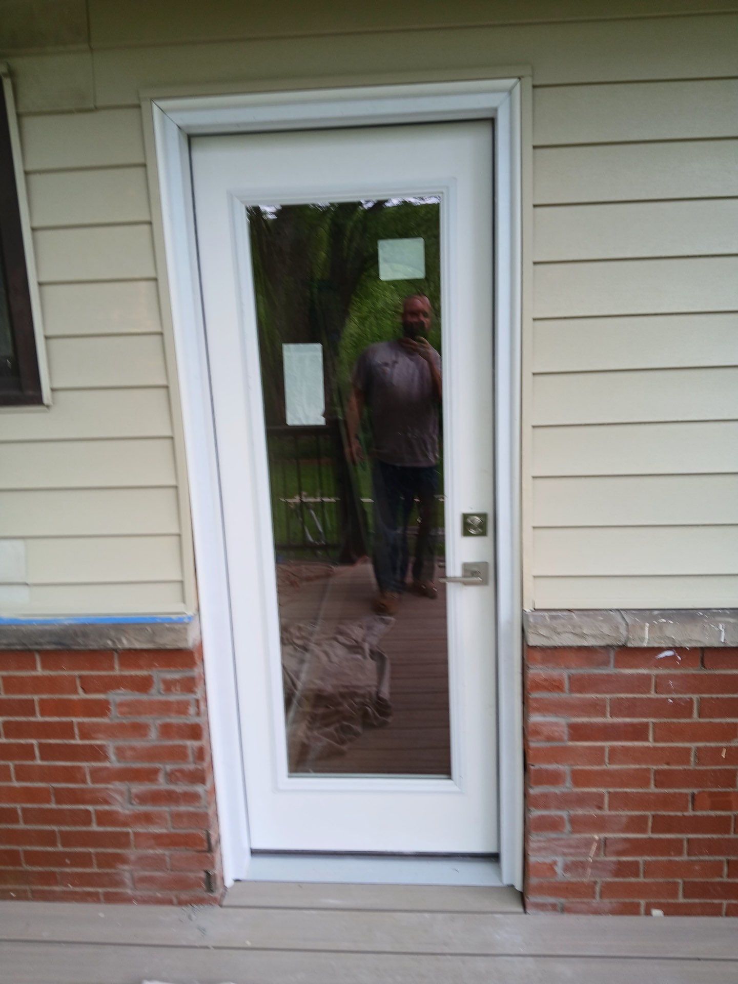Deck and door install by Cousins Roofing Siding & Decks