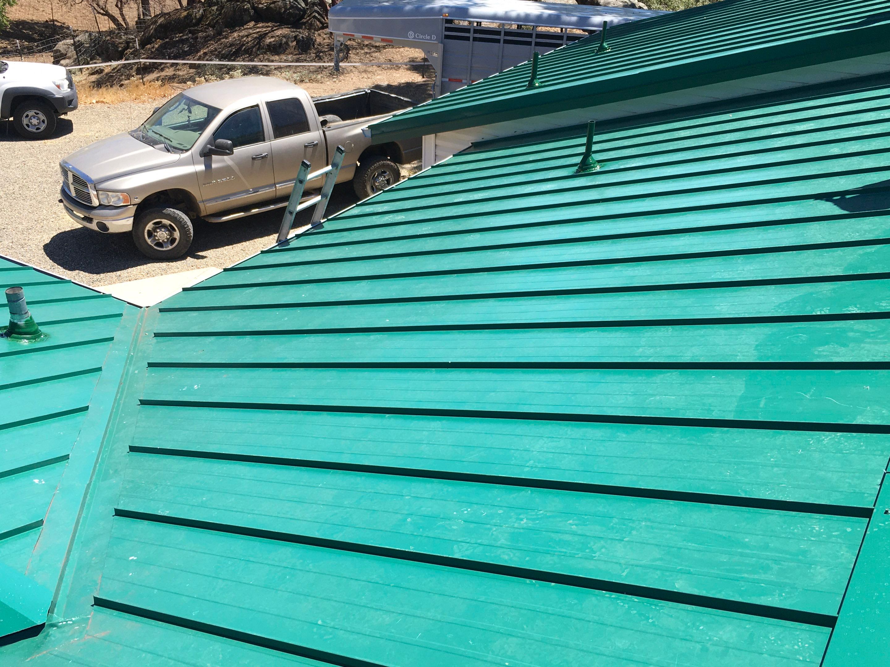 Metal roofing installation using Standing seam metal roofing system by Straight Edge Roofing Inc