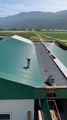 Residential Roofing Installation using IKO 2ply sbs on existing building