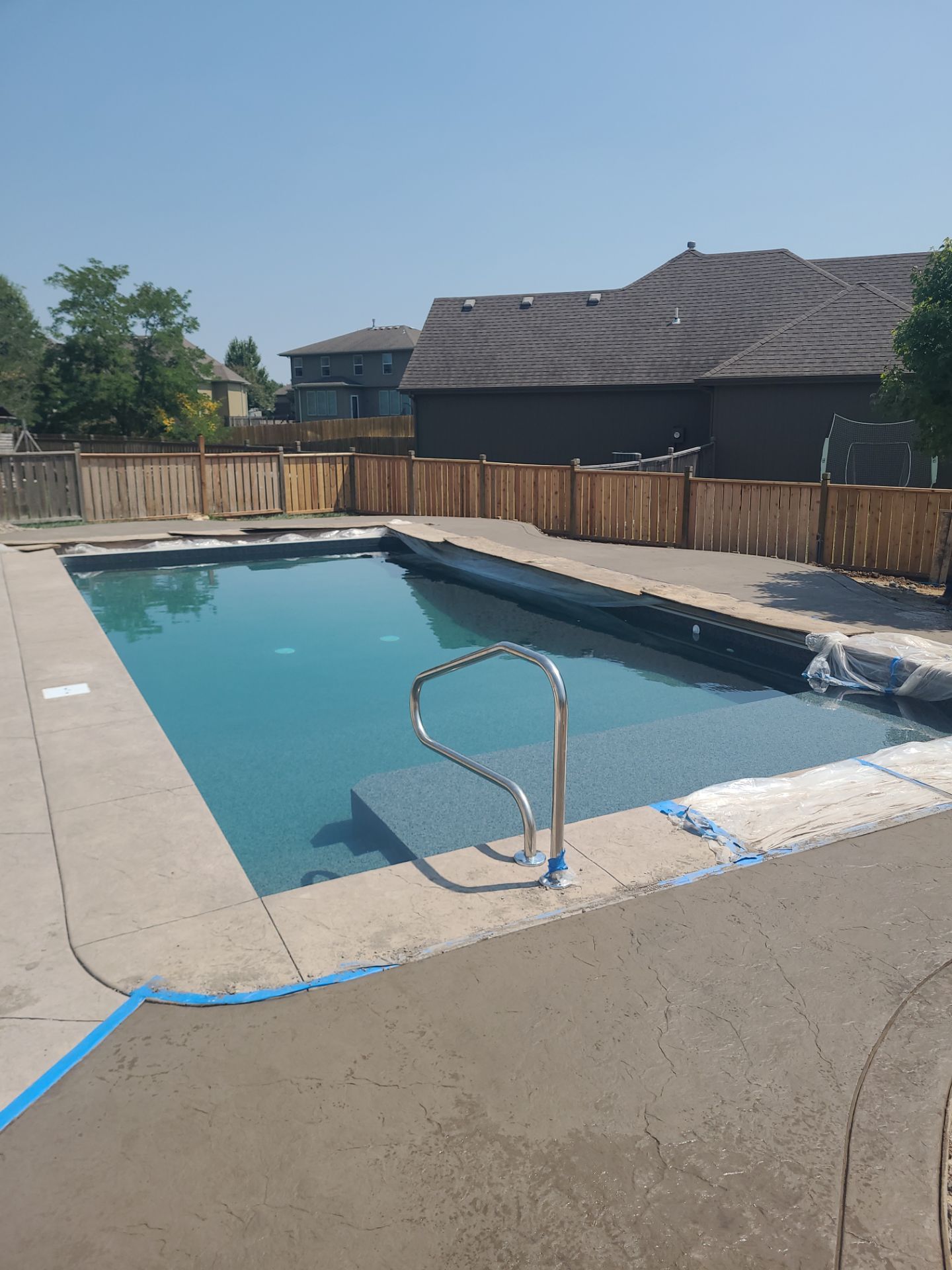 Back Yard Pool Patio by LAND ESCAPES LLC