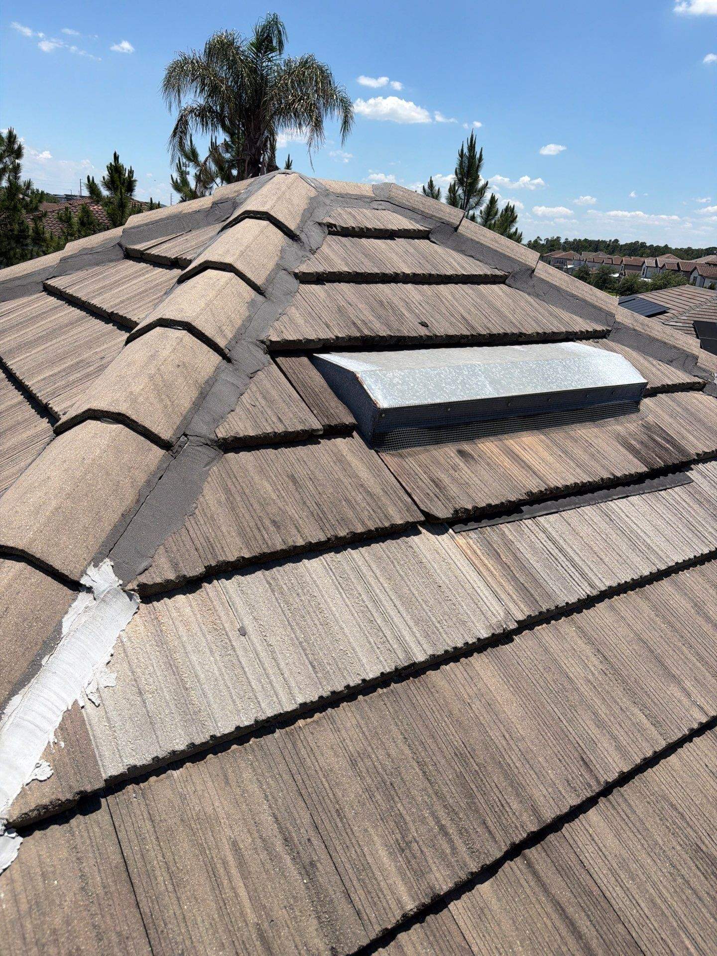 Winter Park Concrete Tile Roof Replacement and Chimney Flashing Installation by Fortified Roofing Solutions Corp.