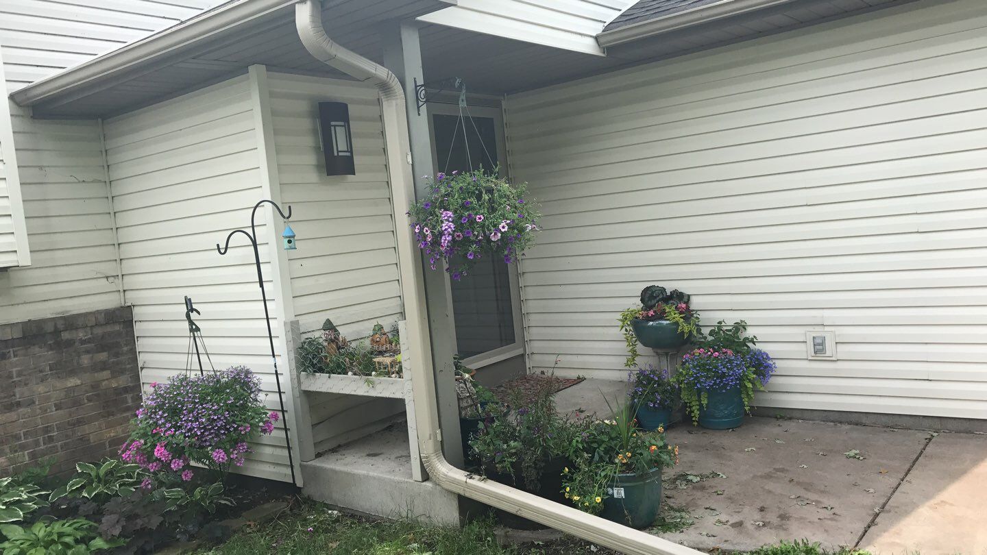 Storm Damage Restoration using Atlas Pinnacle Shingles and Mastic Vinyl Siding  by MODERN EXTERIOR SYSTEMS
