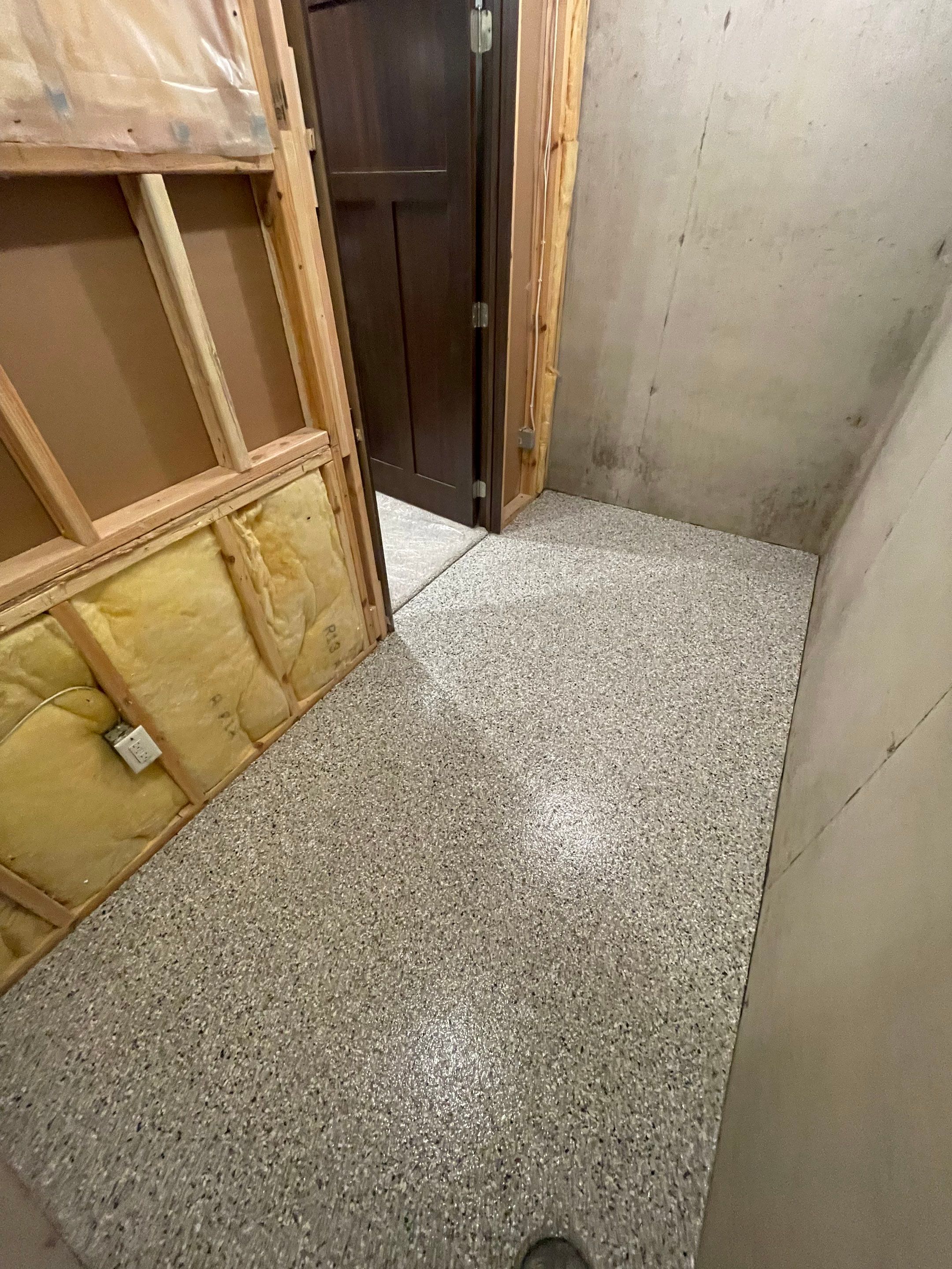 Sioux Falls Basement Floor Transformation with Durable Epoxy Flake Coating by Select Painting, Coatings & Garage Cabinets