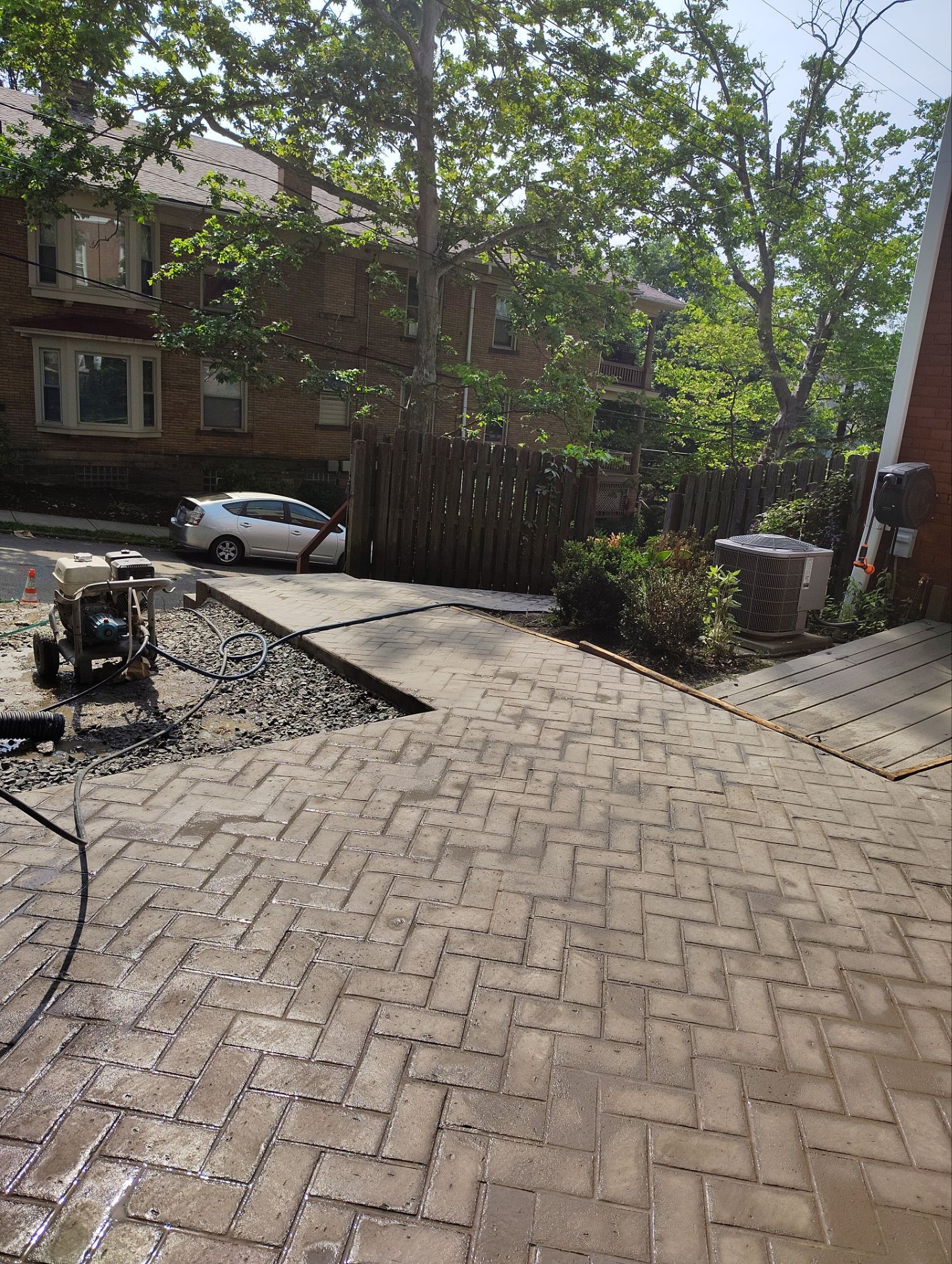 Stamped Concrete and Retaining Wall by Cousins Roofing Siding & Decks