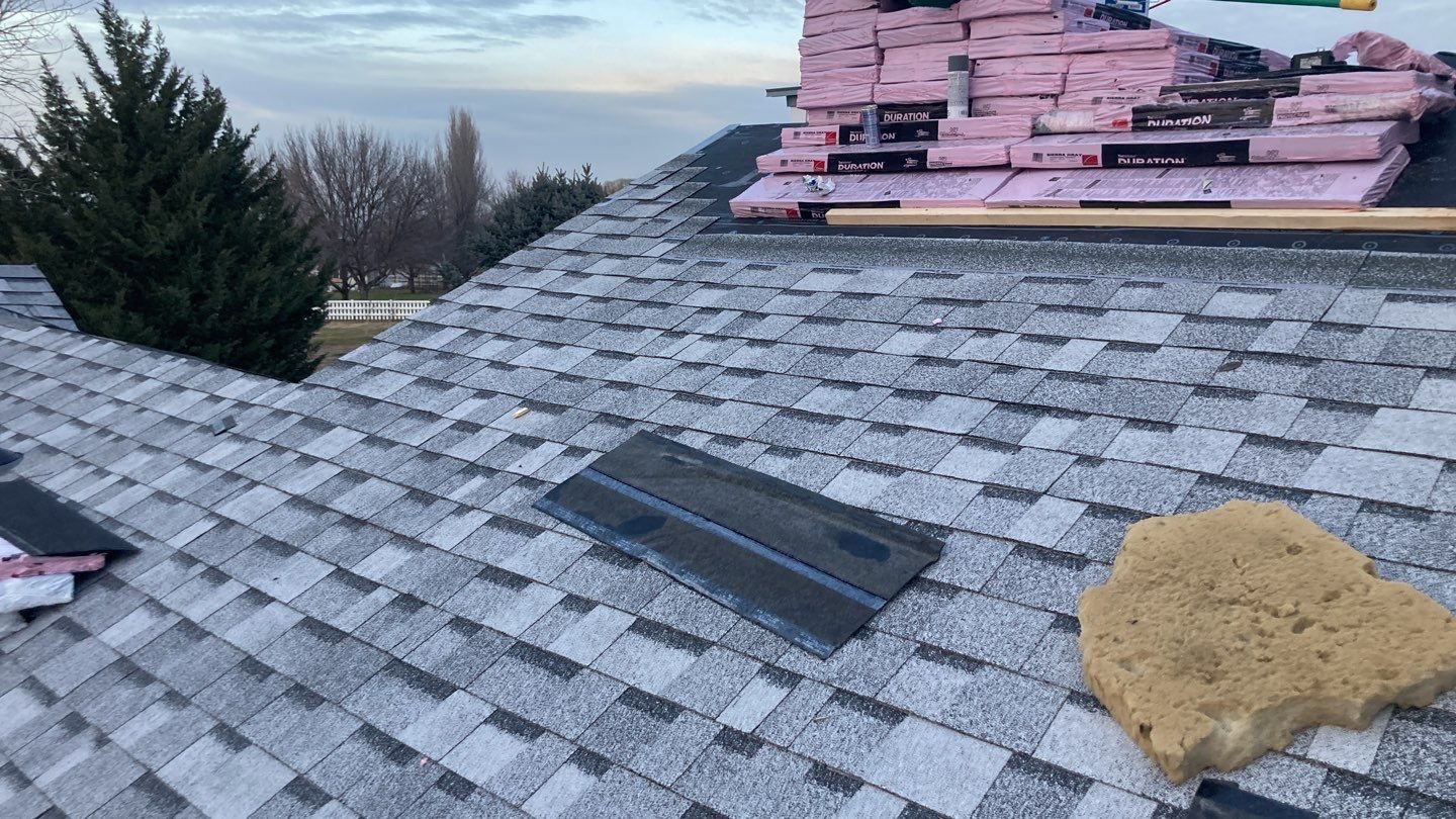 Two story farmhouse style roofing installation using Owens Corning Duration in the color Teak by ID Roofing LLC