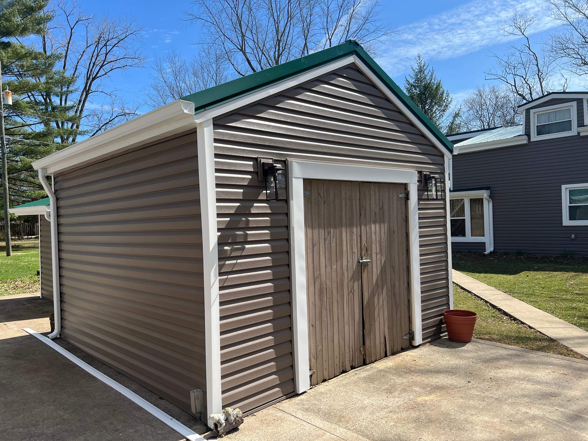 Green Metal Roof Installation and Exterior Renovation in Thornville by Canopy Contracting