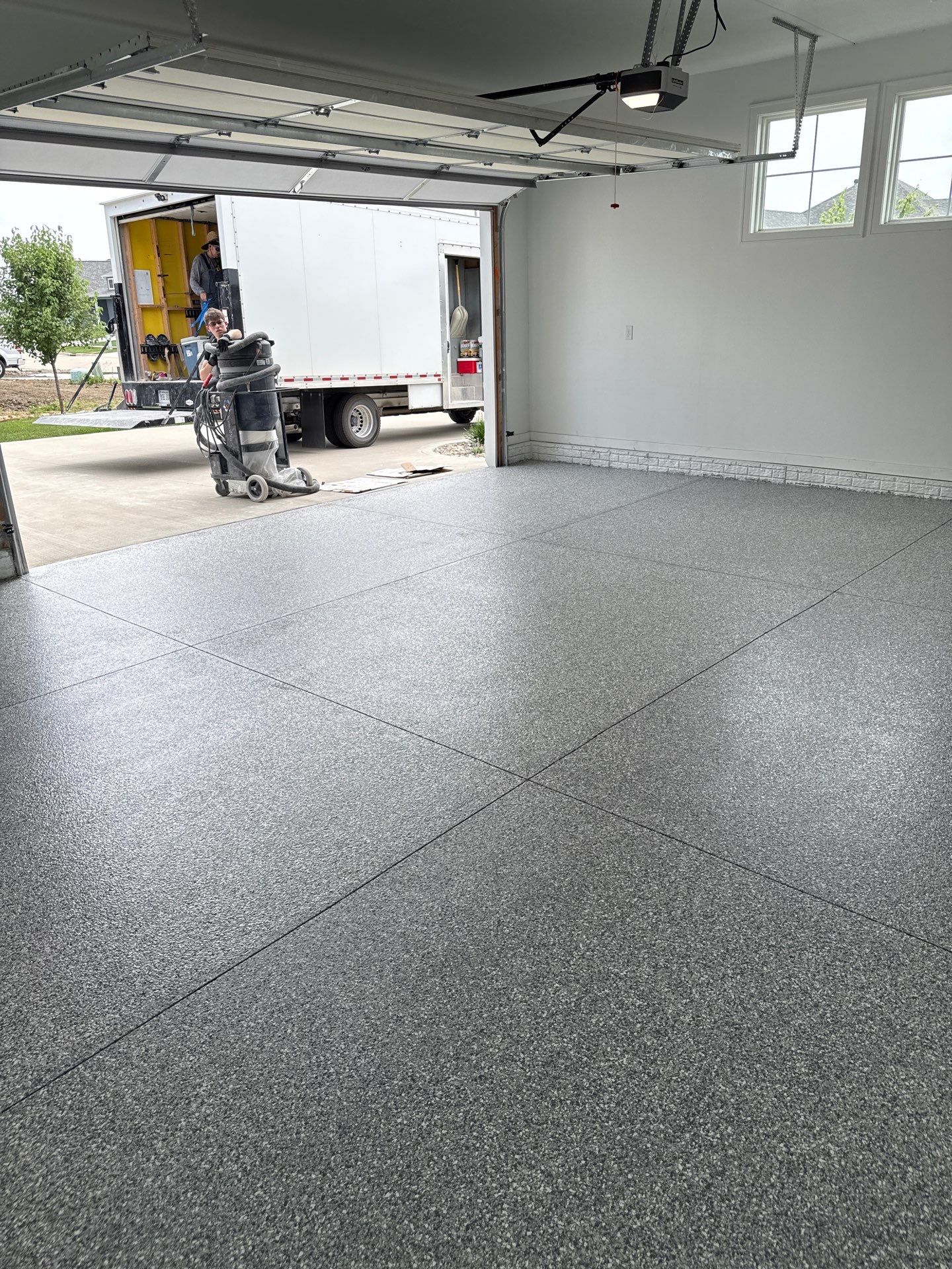 Gravel Flake Garage and Patio Floor Coating for Boone Residence by Revival Concrete Coatings
