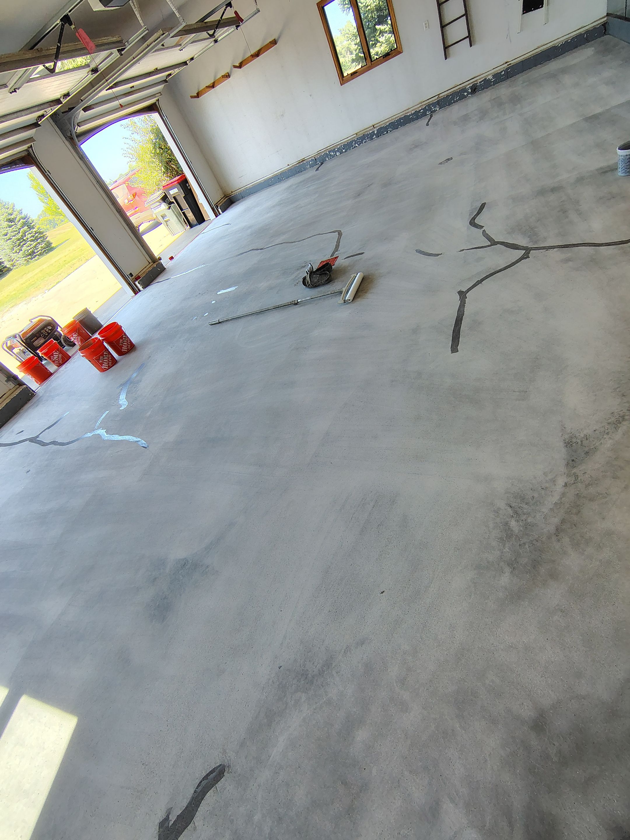Feather Grey Garage Floor Coating Installation in Valley Springs by Select Painting, Coatings & Garage Cabinets