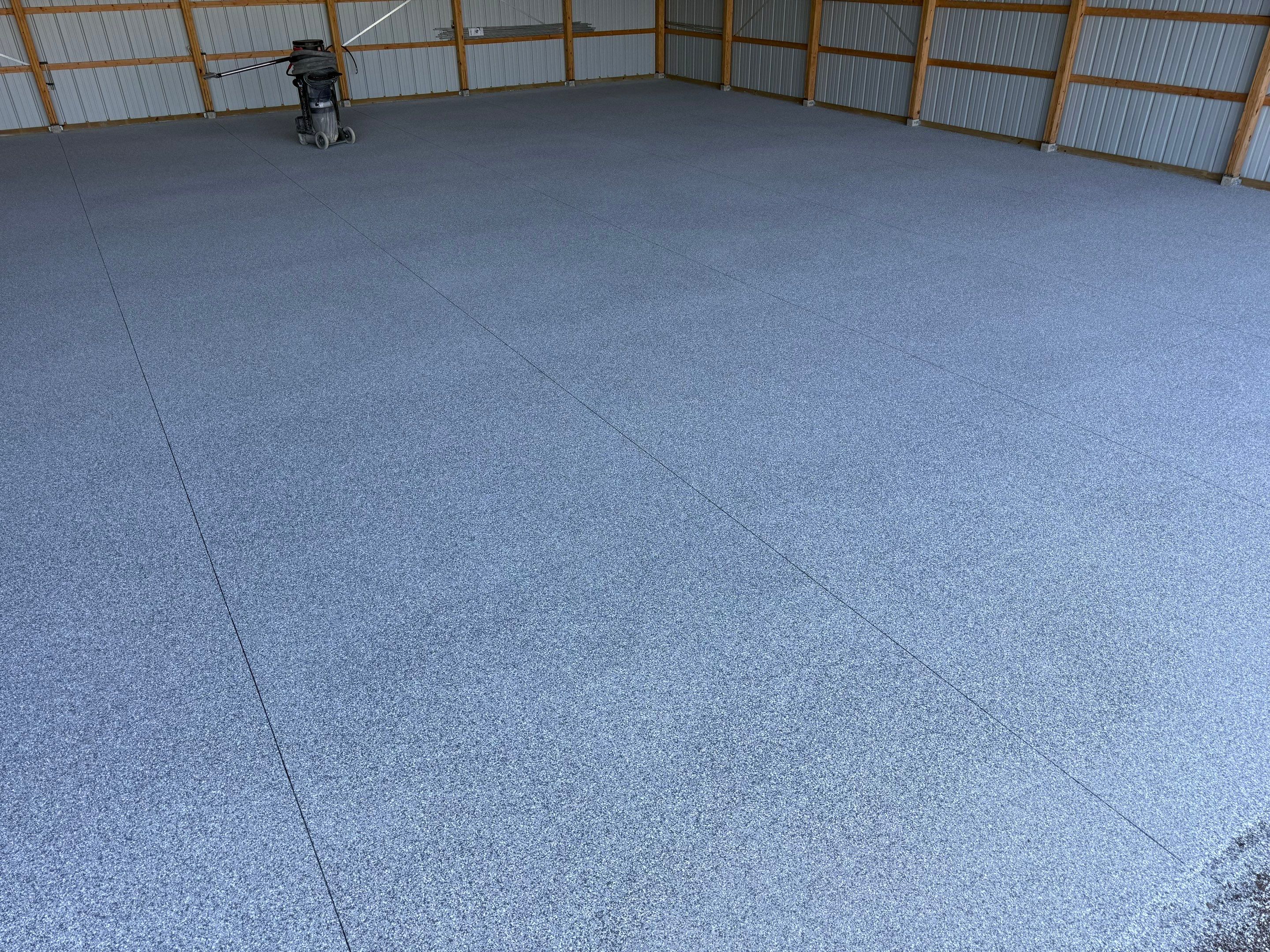 Durable Grey Speckled Epoxy Floor Coating for Yankton Shop by Select Painting, Coatings & Garage Cabinets