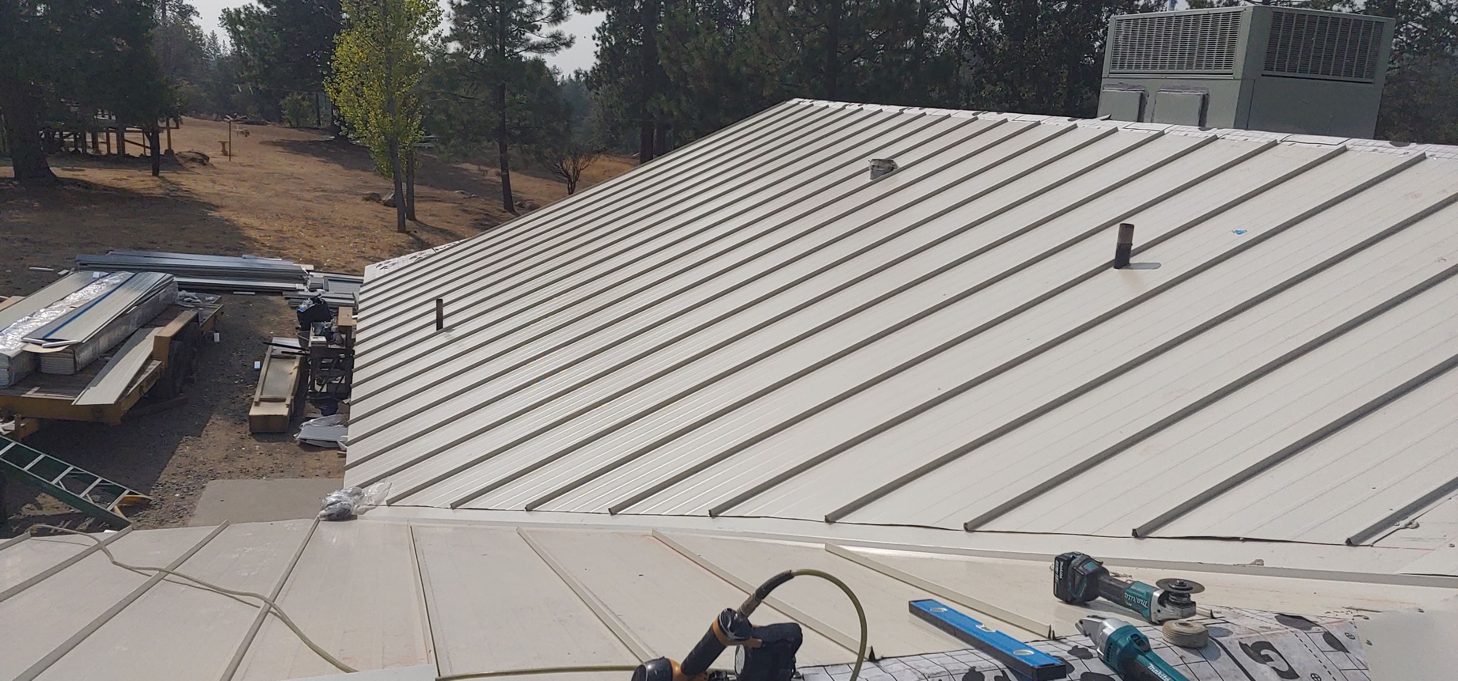 Residential Roofing Installation using Standing seam metal roofing system by Straight Edge Roofing Inc