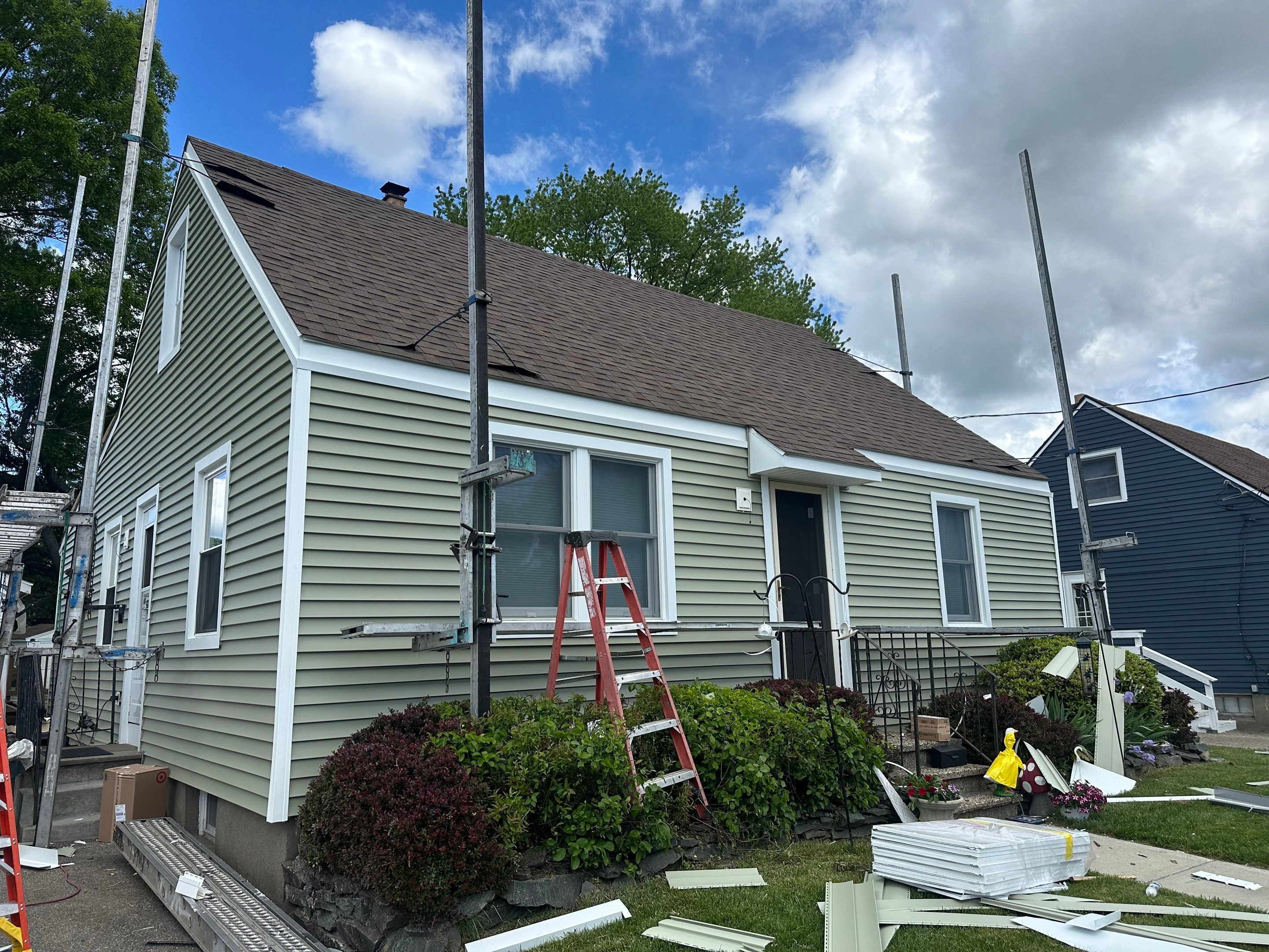 New Vinyl Siding Installation for Milford Home and Detached Garage by A Plus Exterior