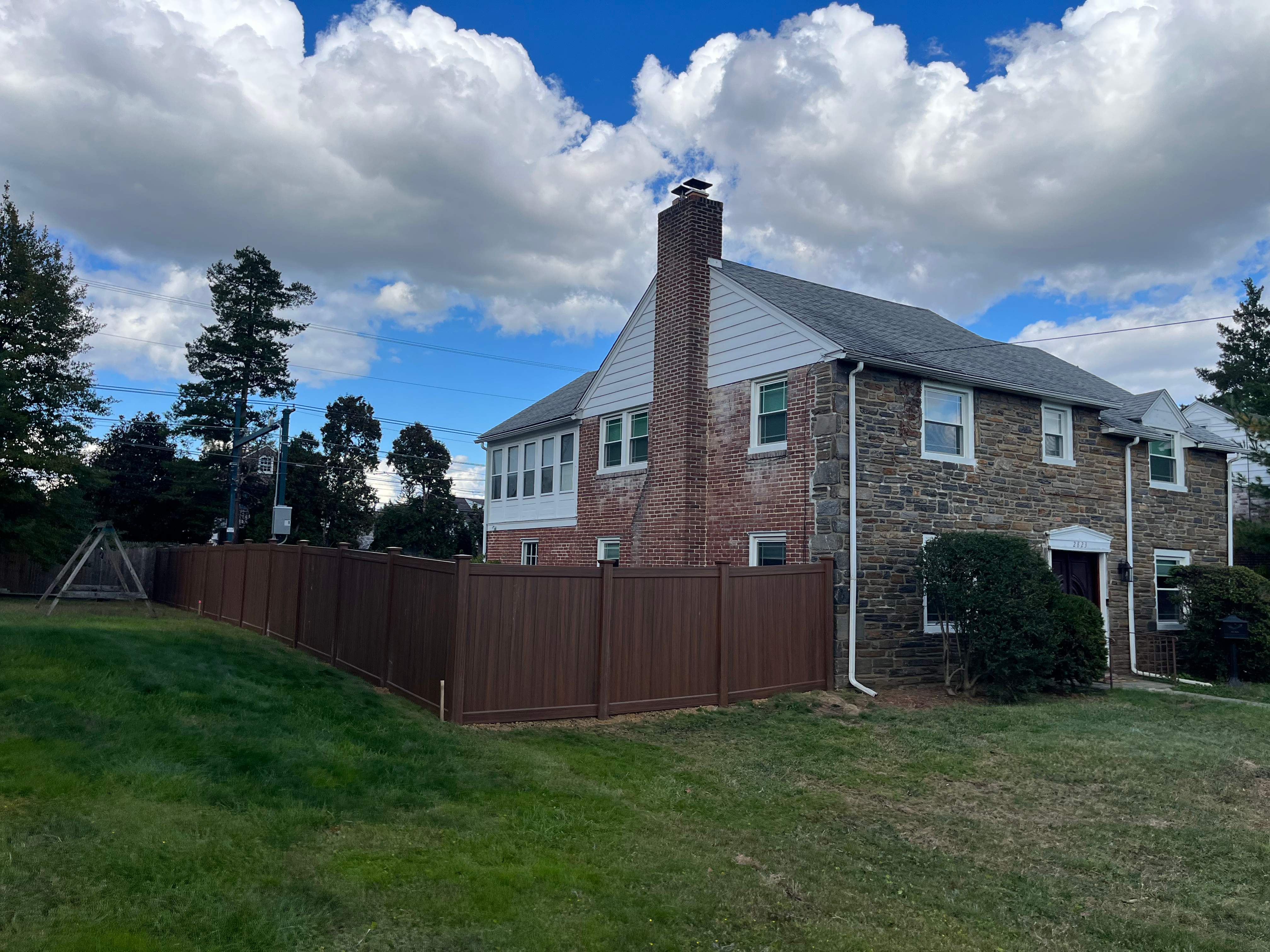 6' High Mocha Walnut Vinyl Installation by Jensen Fencing