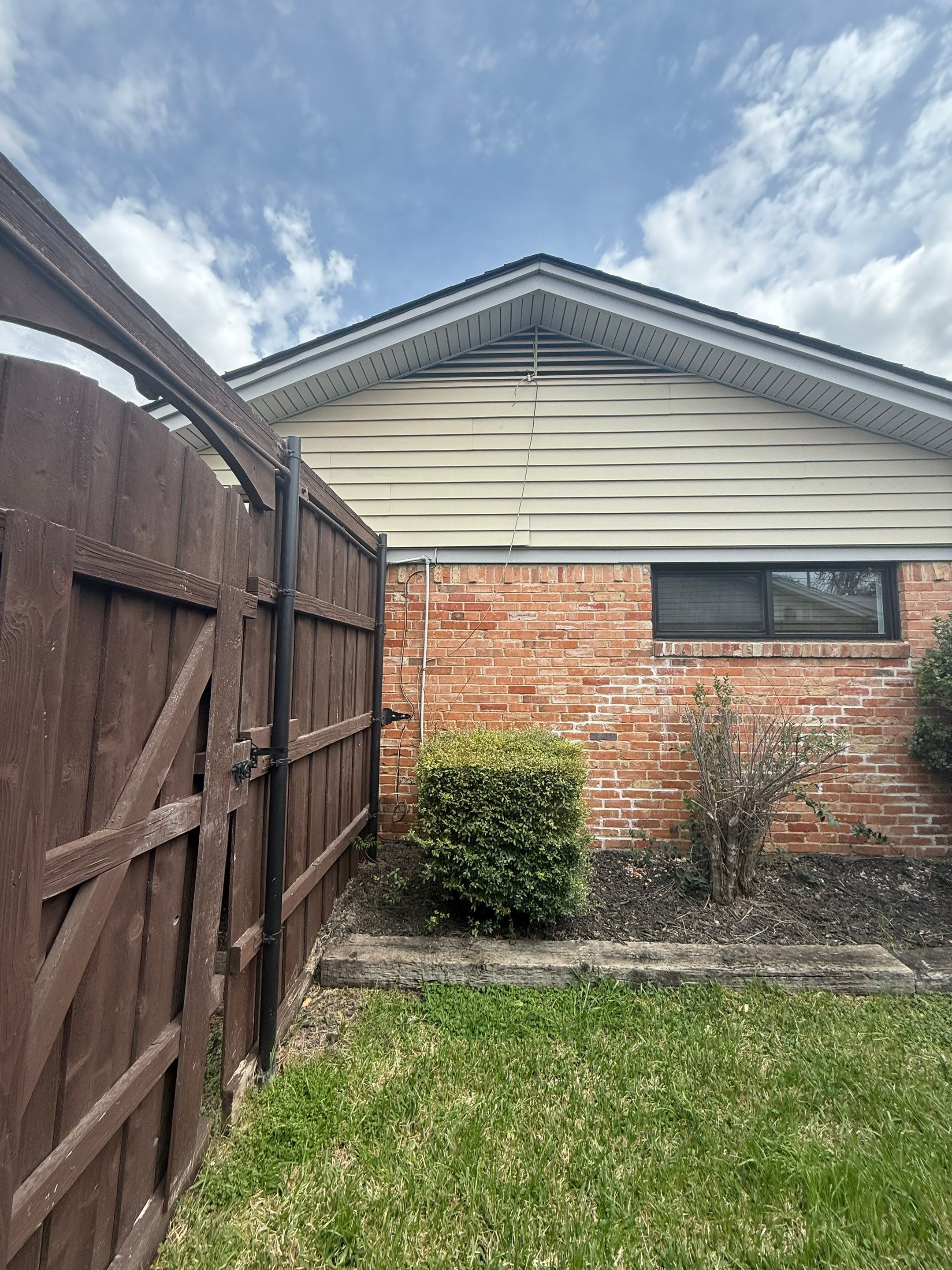 Exterior Home Paint Project with Different Surfaces by SLM General Contractors & Roofing
