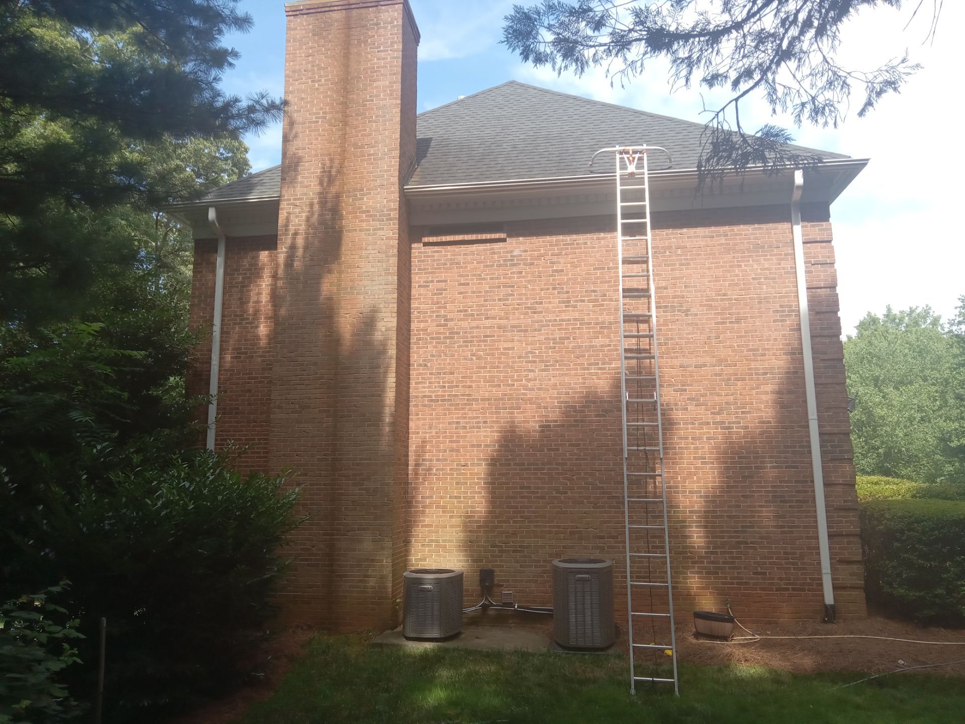 pressure washing exterior brick walls and possibly gutters with ladder for high access areas