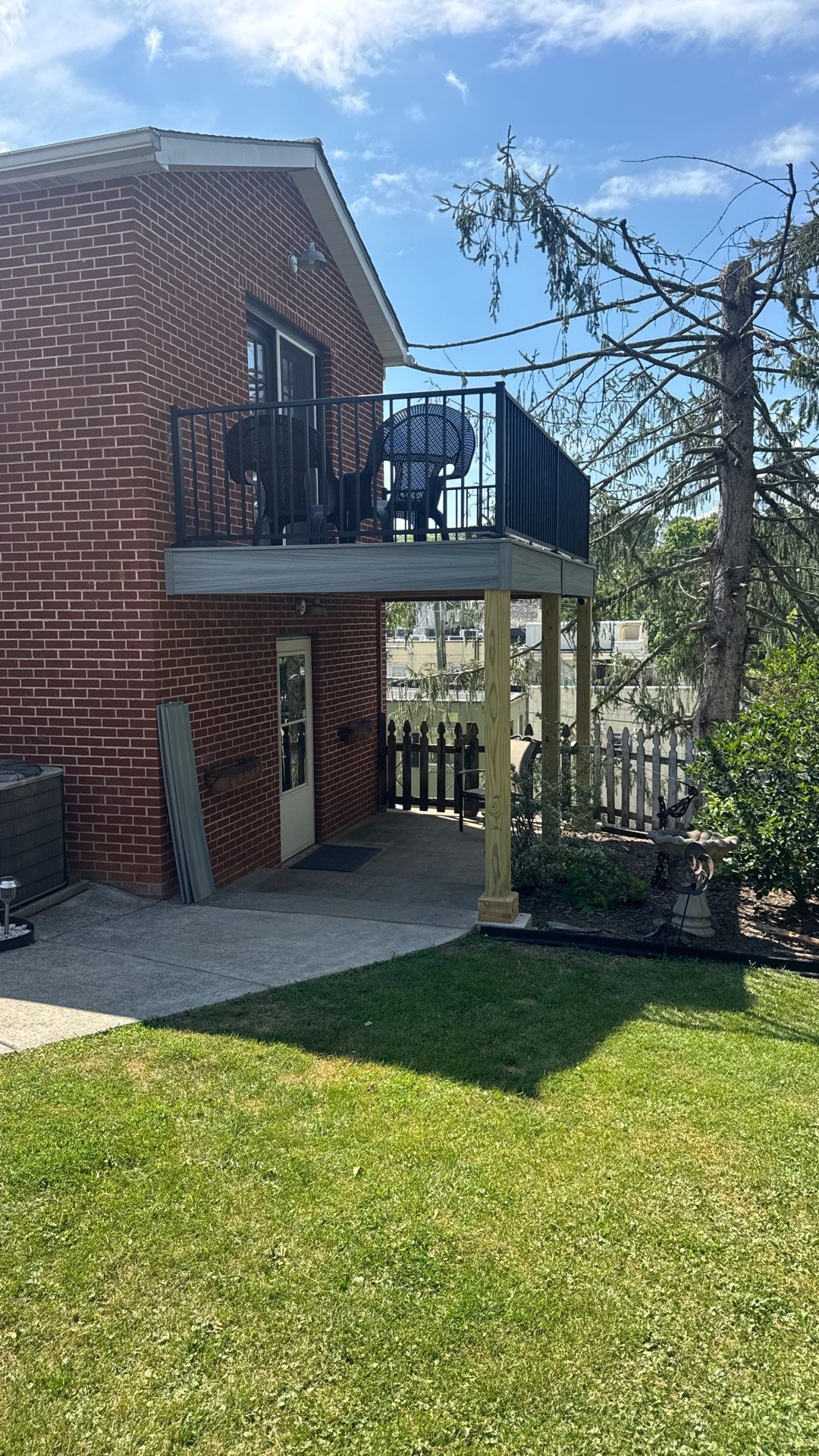 Elevated Composite Deck Rebuild with Black Metal Railing in Lewisburg