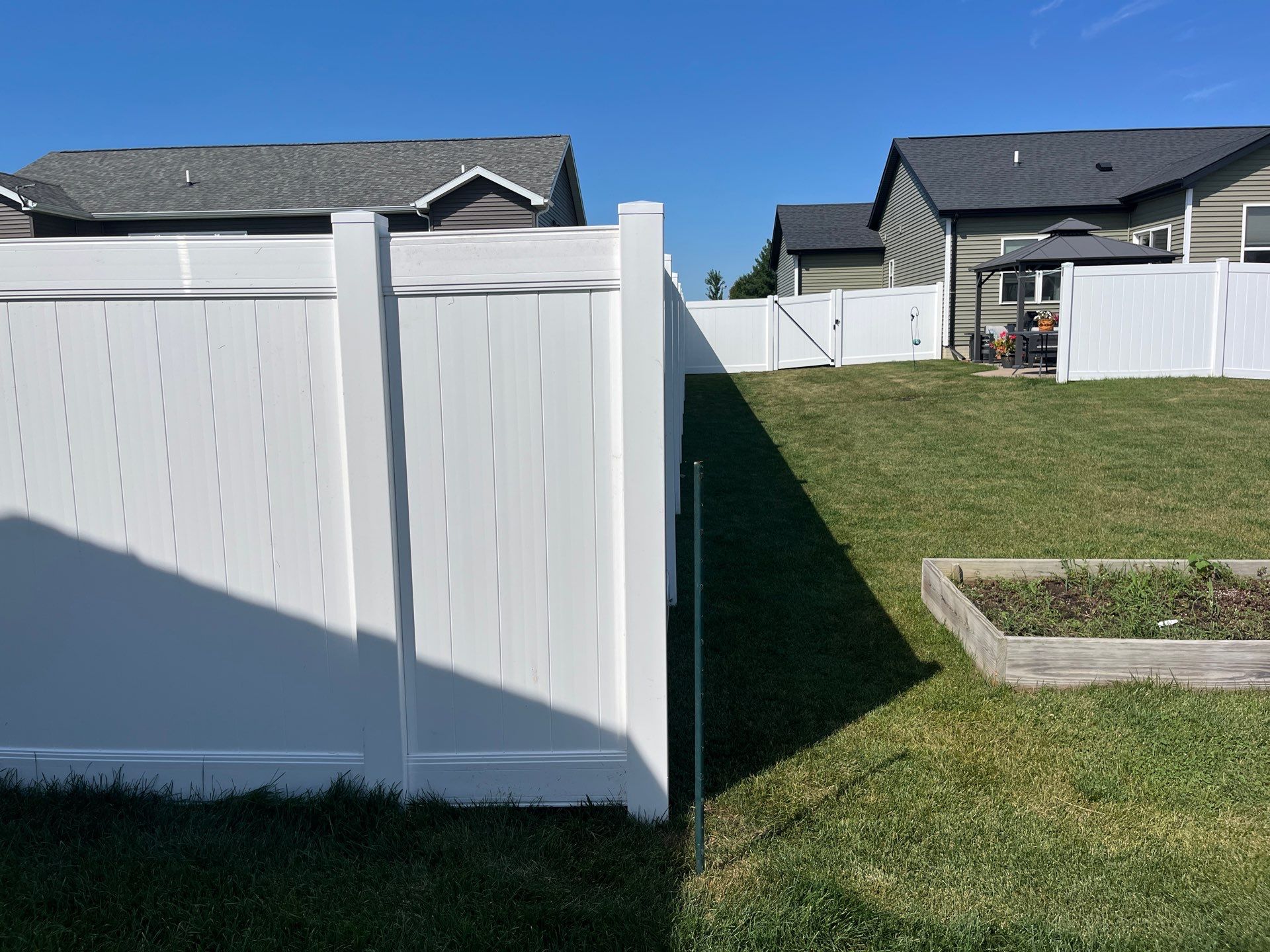 New Vinyl Privacy Fencing and Gates for Waterloo Residential Backyard by Perfect Picket Fence and Stain
