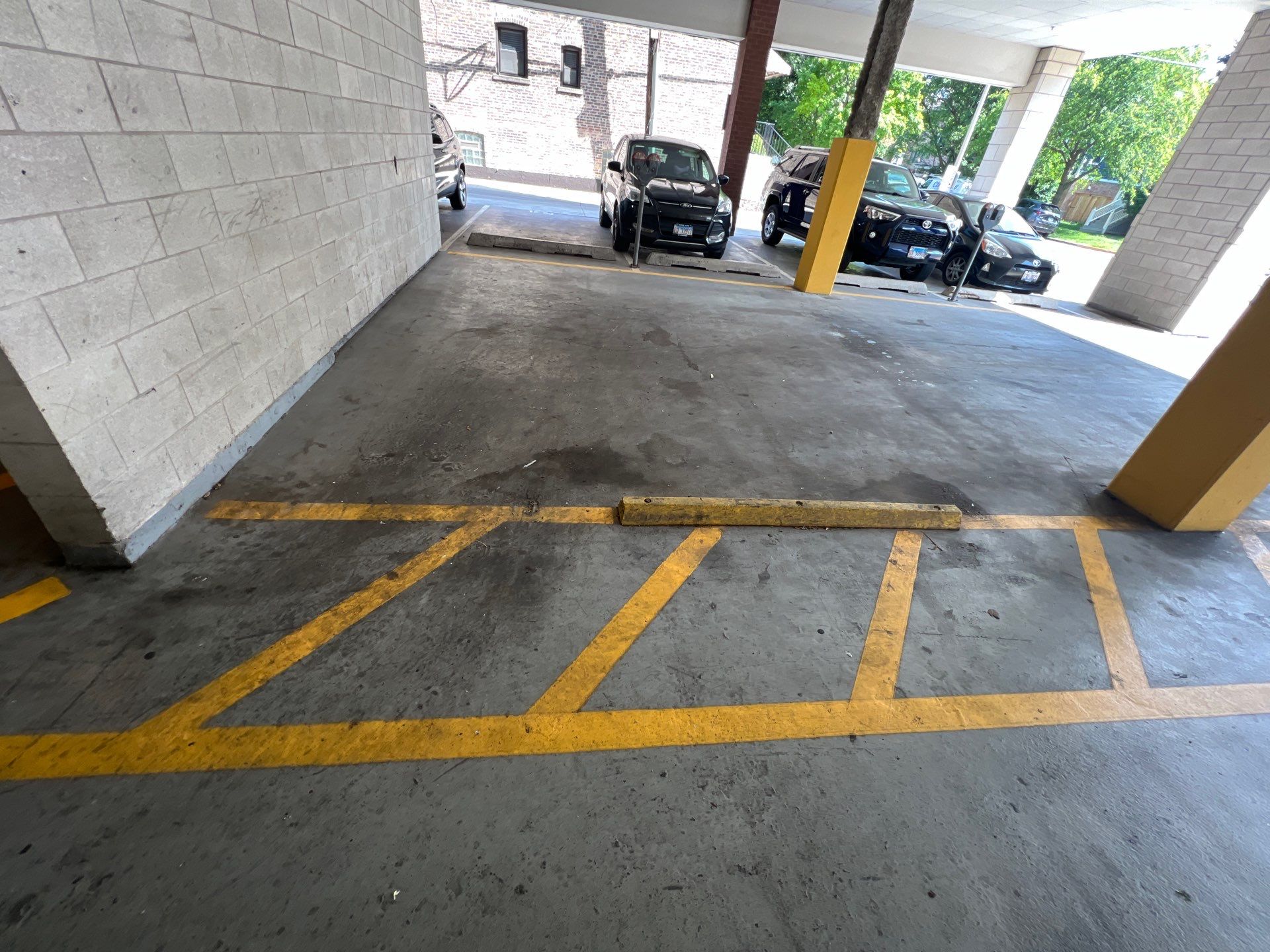 Parking garage using Hot water by Northern Power Washing LLC.