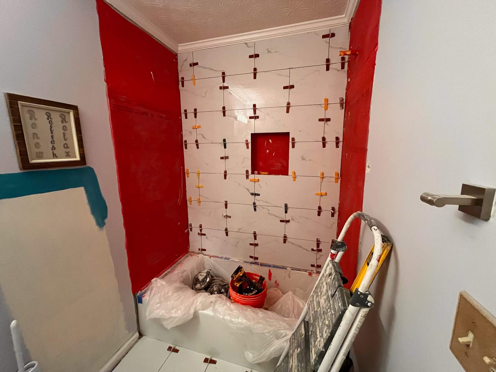 Guest bathroom tub and flooring by Prudencio