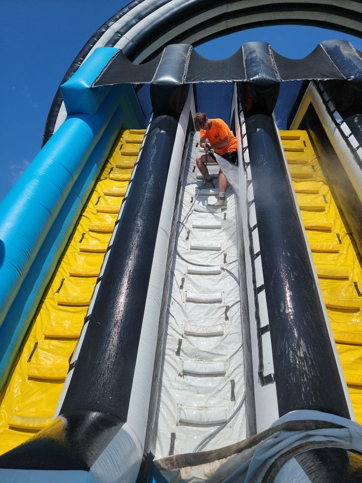 Cleaning for big bounce america prior to a large event by Northern Power Washing LLC.