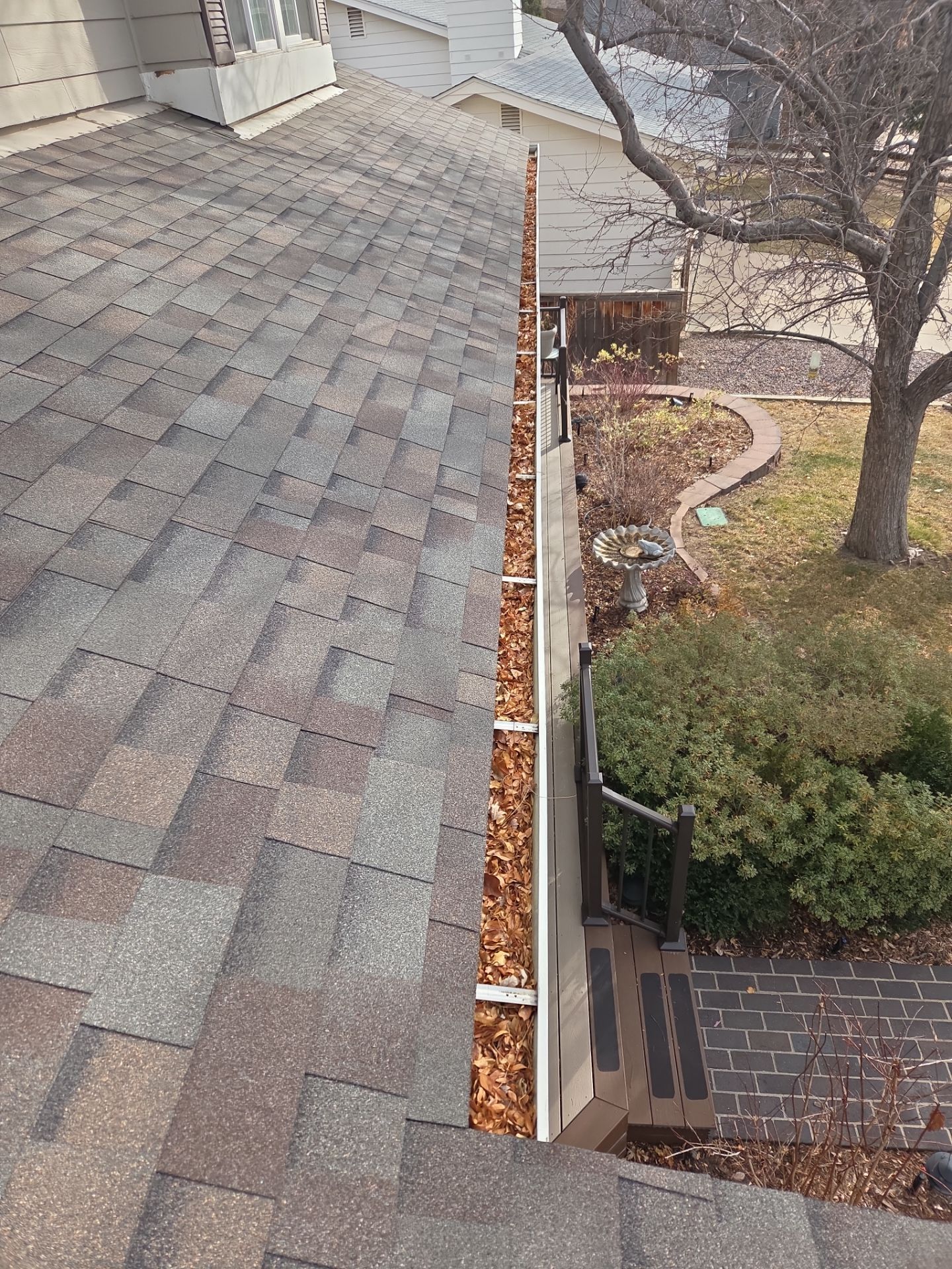 Clean Gutters and Downspouts by RTP Roofing Company