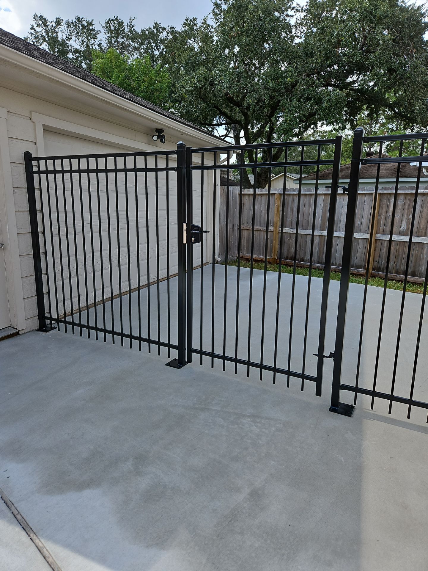 Iron fence installation using 6ft - 3 Rail - Ameristar Montage by Tim's Fences