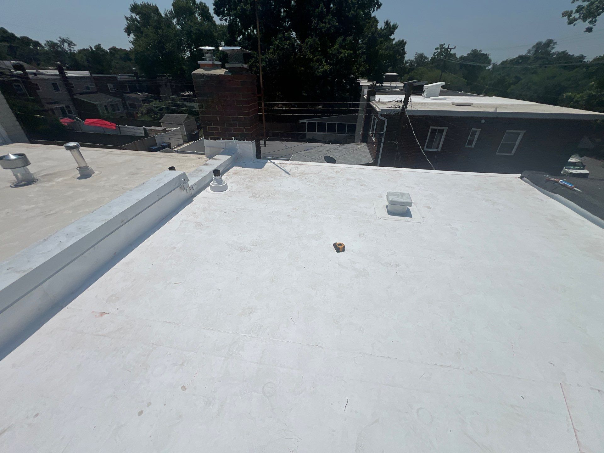 Townhouse Flat Roof Replacement using Carlisle TPO System by USA Storm Roofing and Construction Group