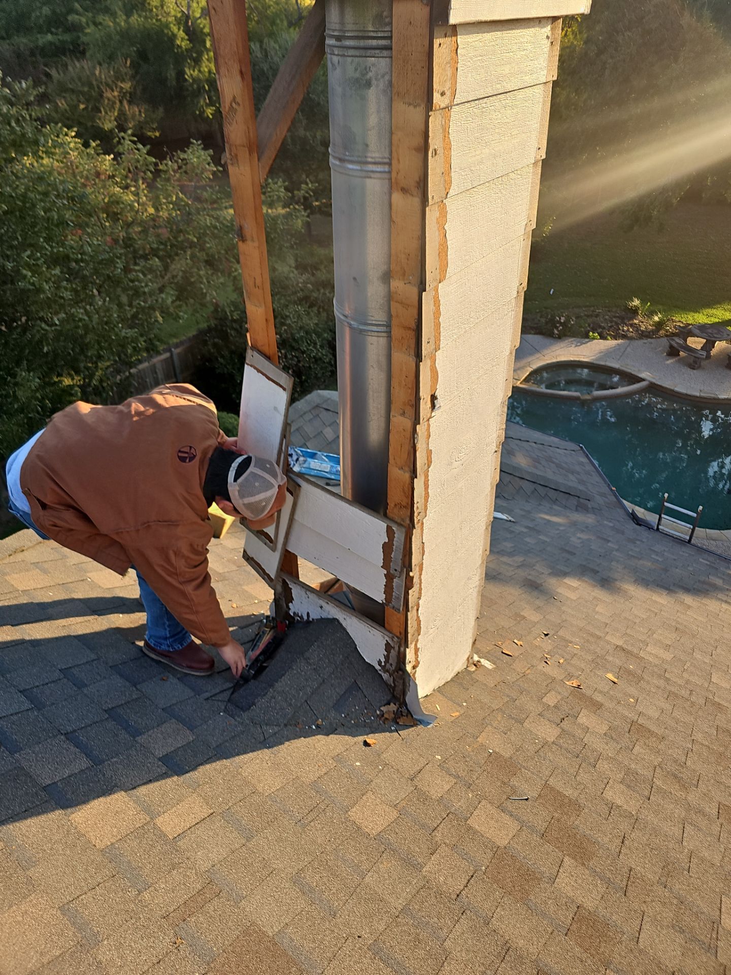 chimney repair using lap engineered treated composite siding. by road roofing llc