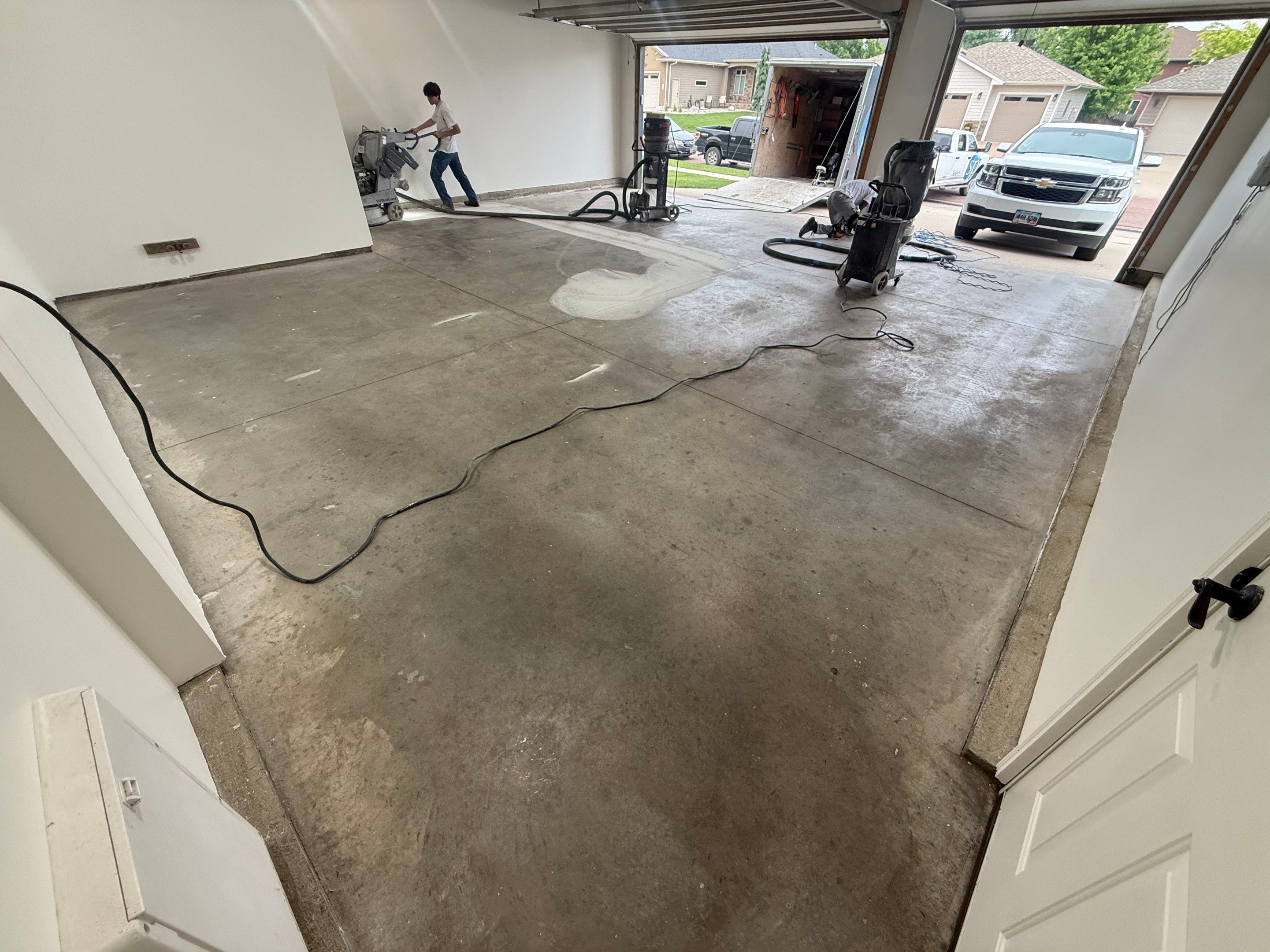 Full Garage Floor Resurfacing and Decorative Epoxy Flake Finish by Select Painting, Coatings & Garage Cabinets