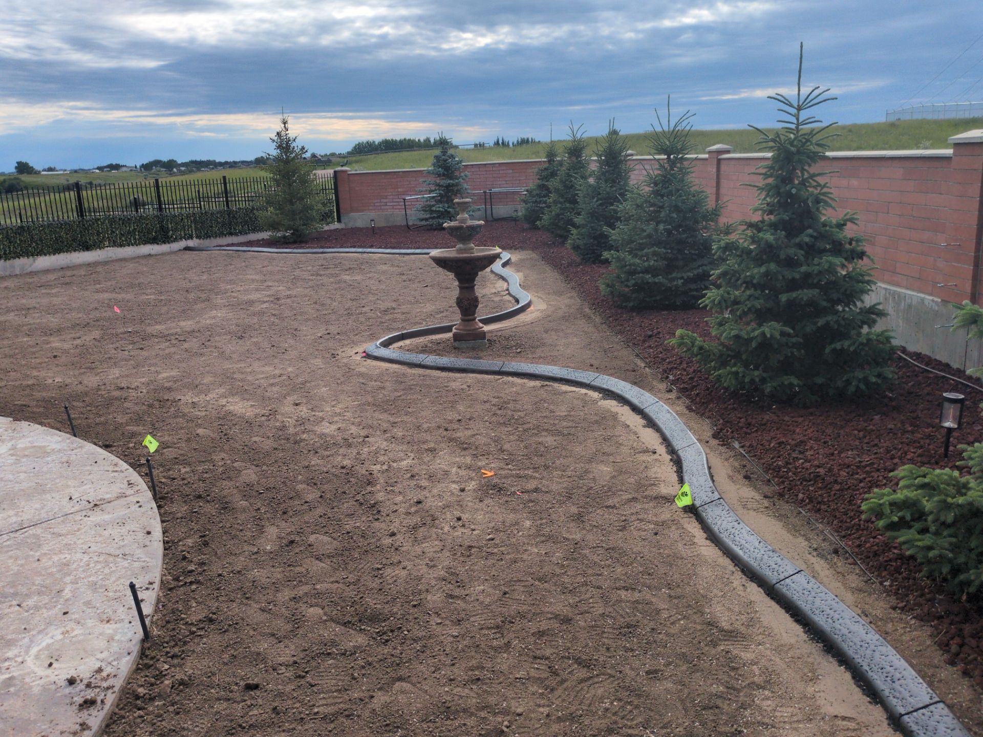 Custom Decorative Concrete Curbing Installation in Desert Blume by Pump it Up Concrete Jacking