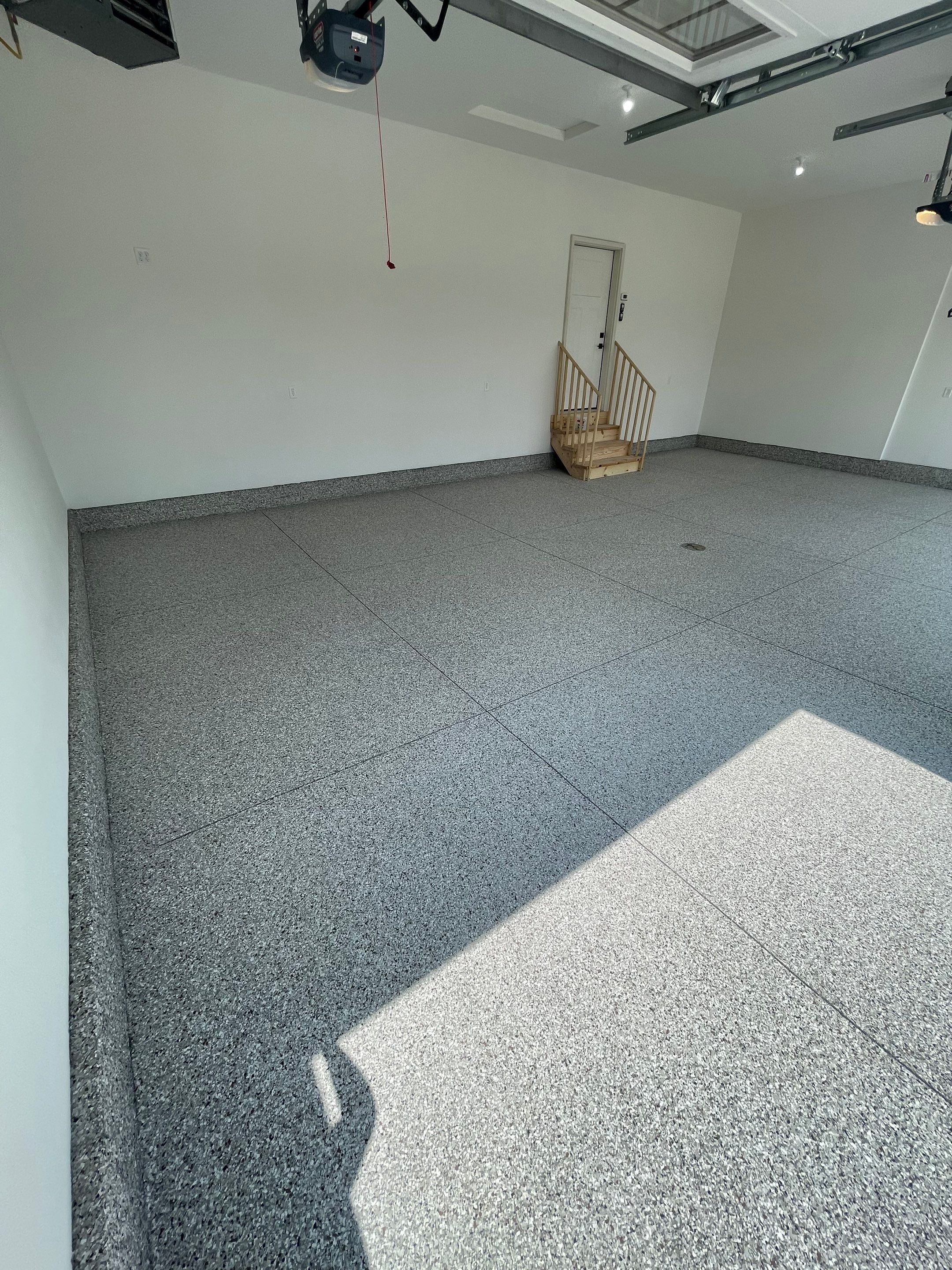 Grey Speckled Garage Floor Coating in Sioux Falls by Select Painting, Coatings & Garage Cabinets