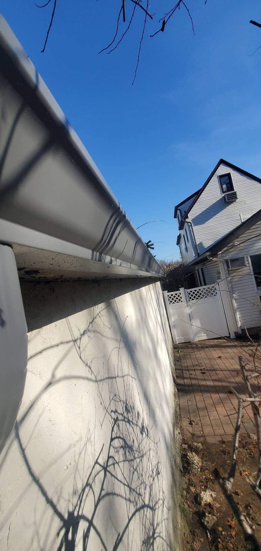 New Roof & Gutters by Island Roofing Inc.