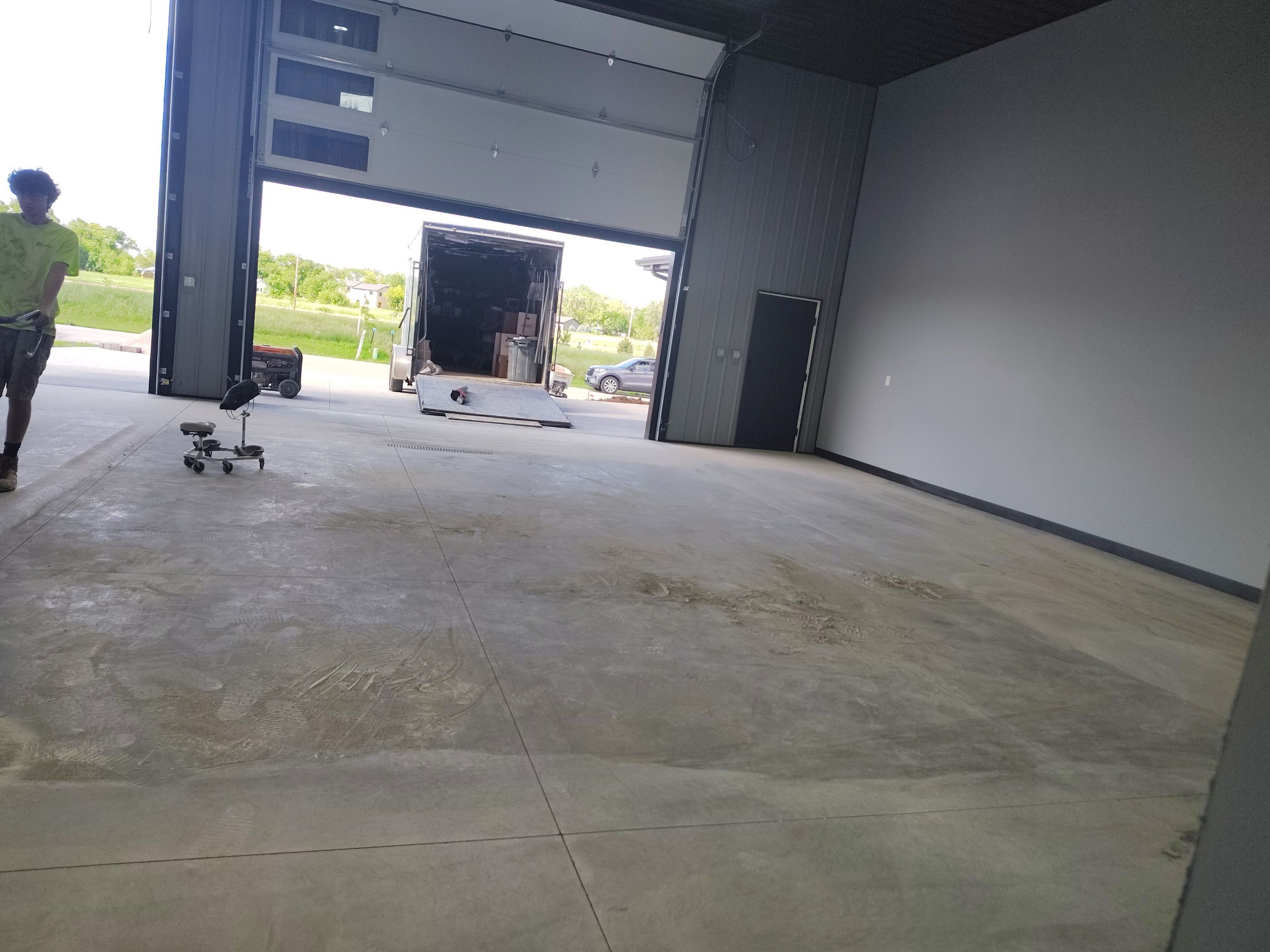 Polyaspartic Garage Floor Coating with Decorative Flake in Wentworth by Select Painting, Coatings & Garage Cabinets