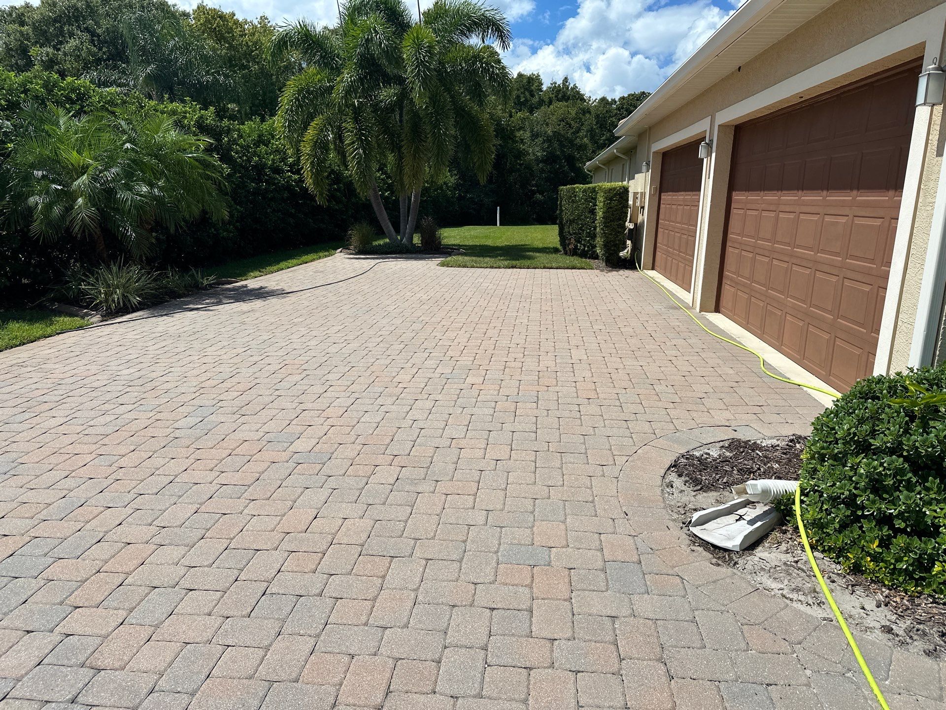 Paver Driveway, Entryway, Sidewalk, and Street Curbing Cleaning in Winding River Community, Bradenton, FL by Sunshine AquaWash