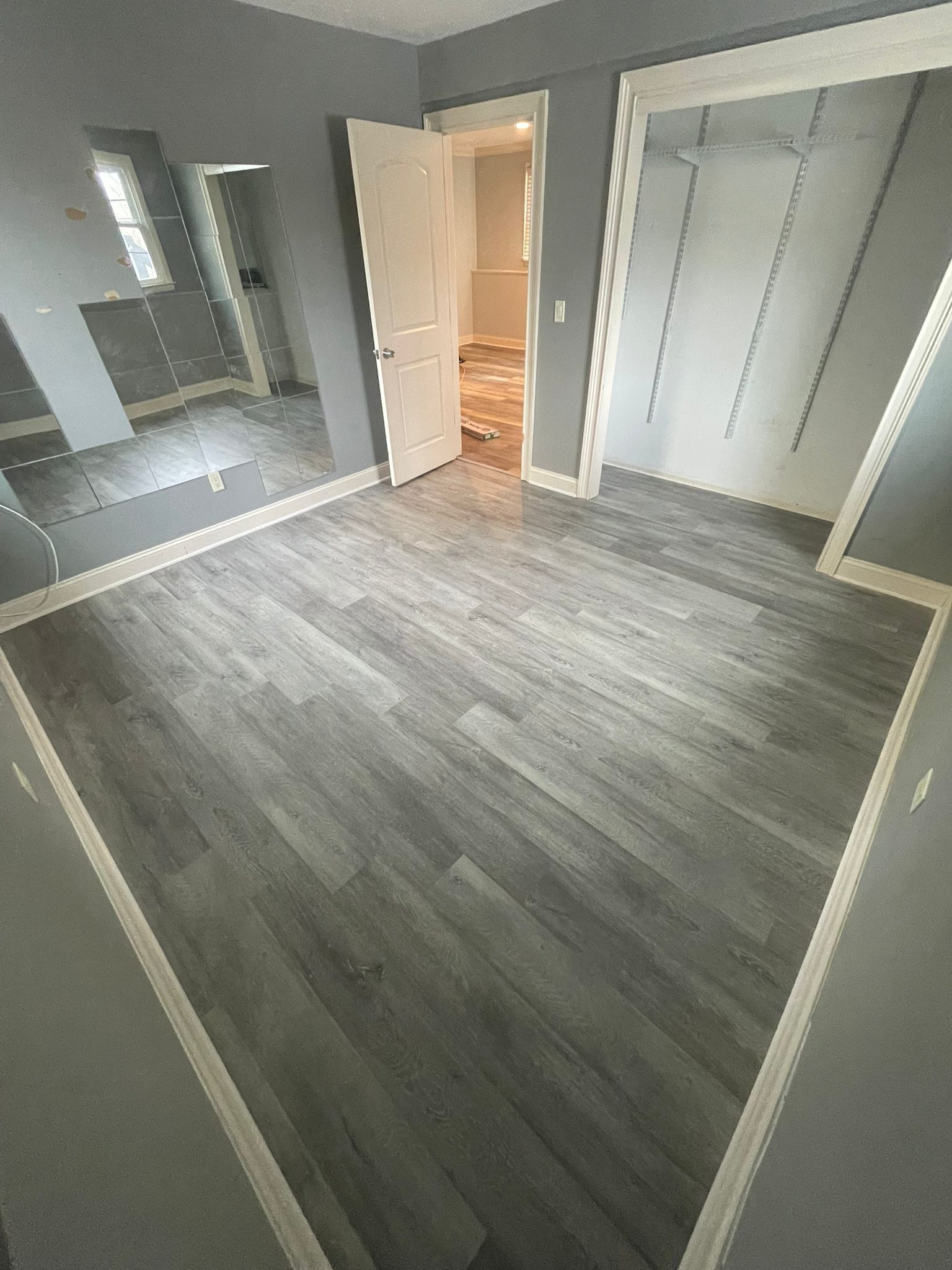 Refinish Red Oak and Installed LVP using Permshield Lite LVP - Bona Semi and Duraseal Jacobean Stain by Footprints Floors Morristown