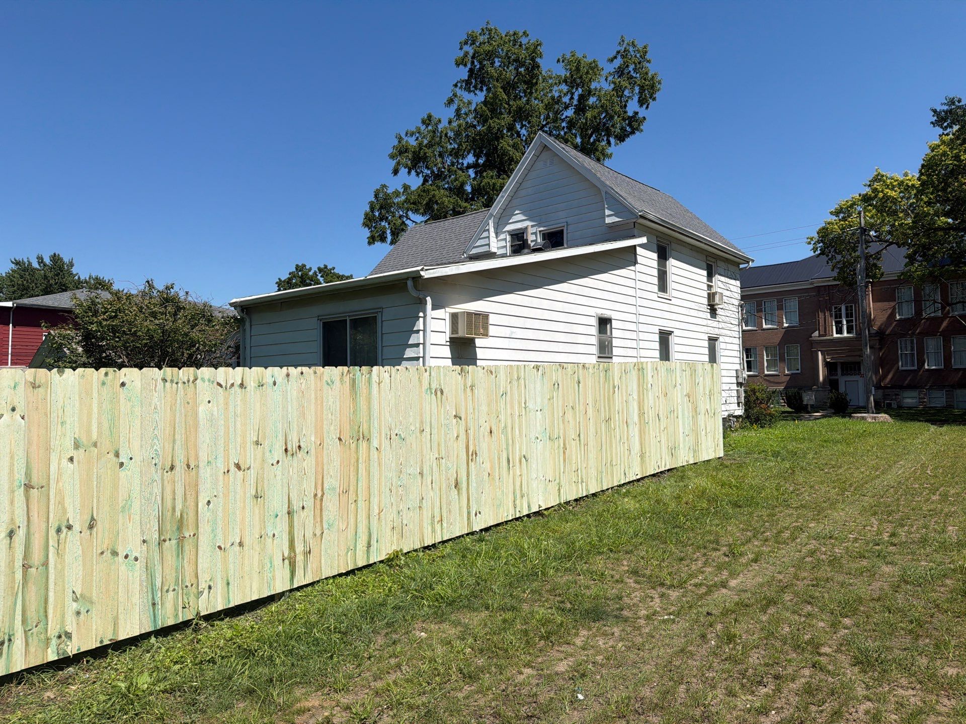 Pressure-Treated Wood Privacy Fence Installation in Waterloo by Perfect Picket Fence and Stain