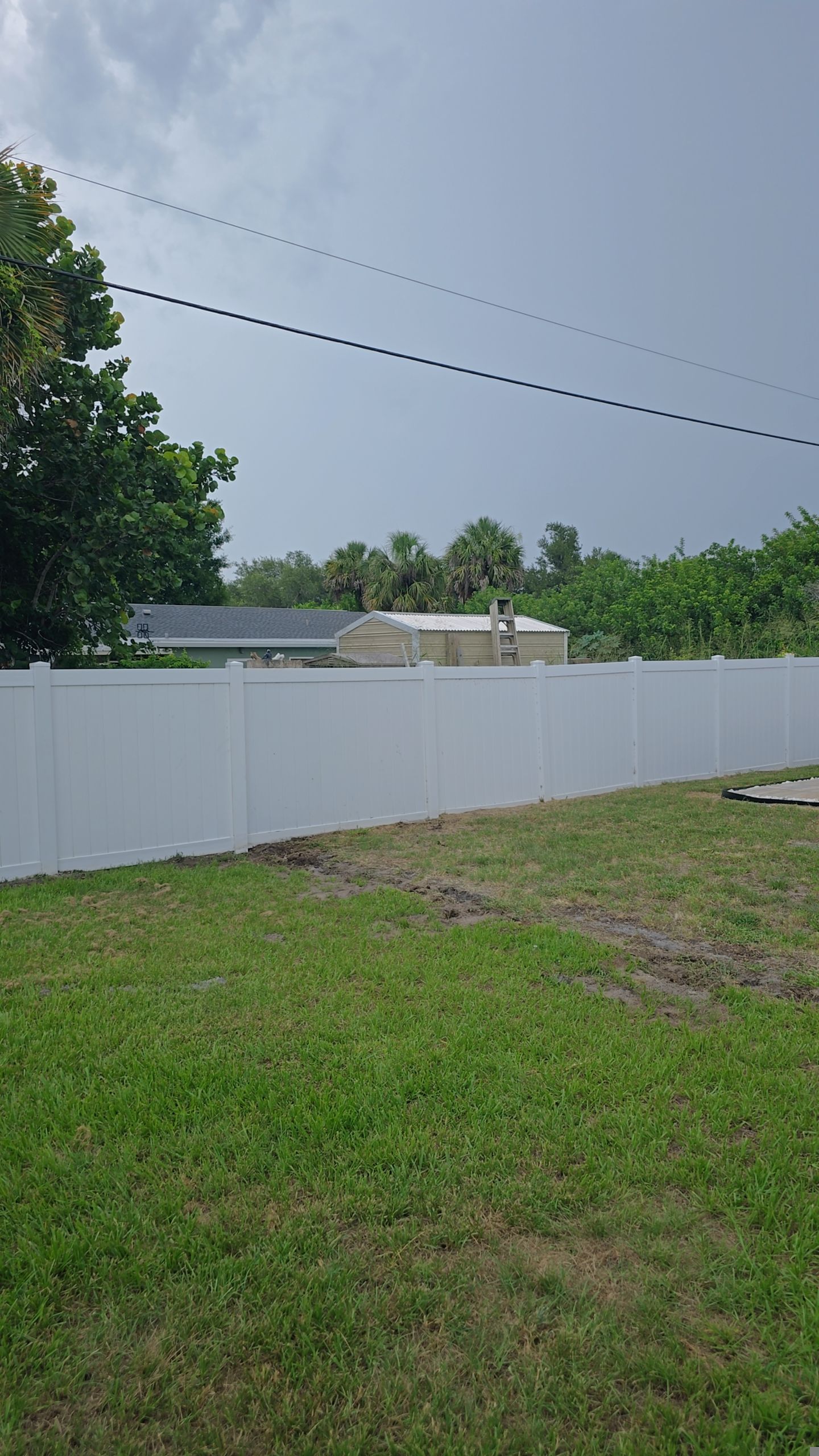 White Vinyl Privacy Fence Installation and Gate Repair in Port Charlotte by True Fence LLC