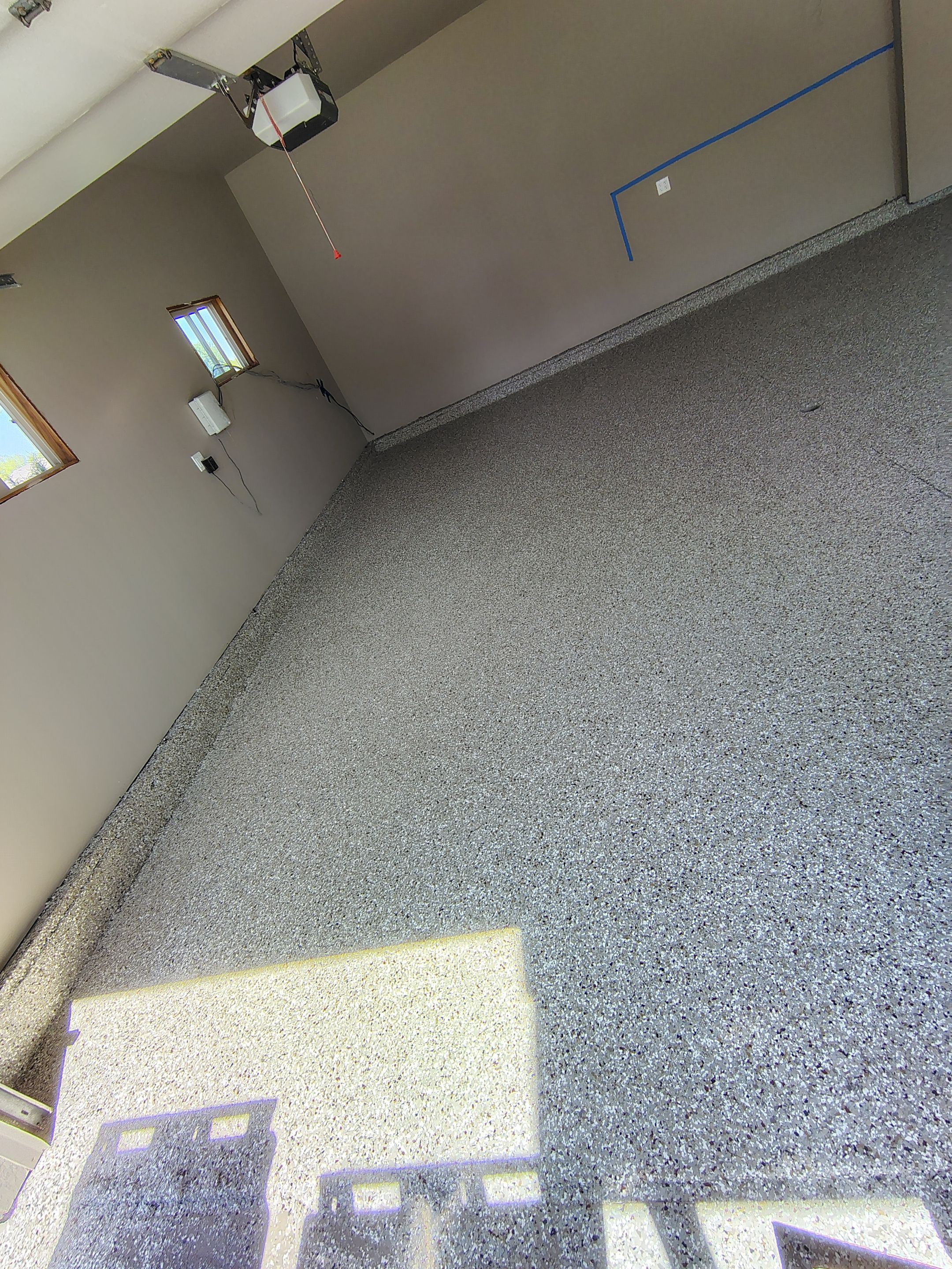 Sioux Falls Garage Concrete Repair and Epoxy Flake Floor Coating by Select Painting, Coatings & Garage Cabinets