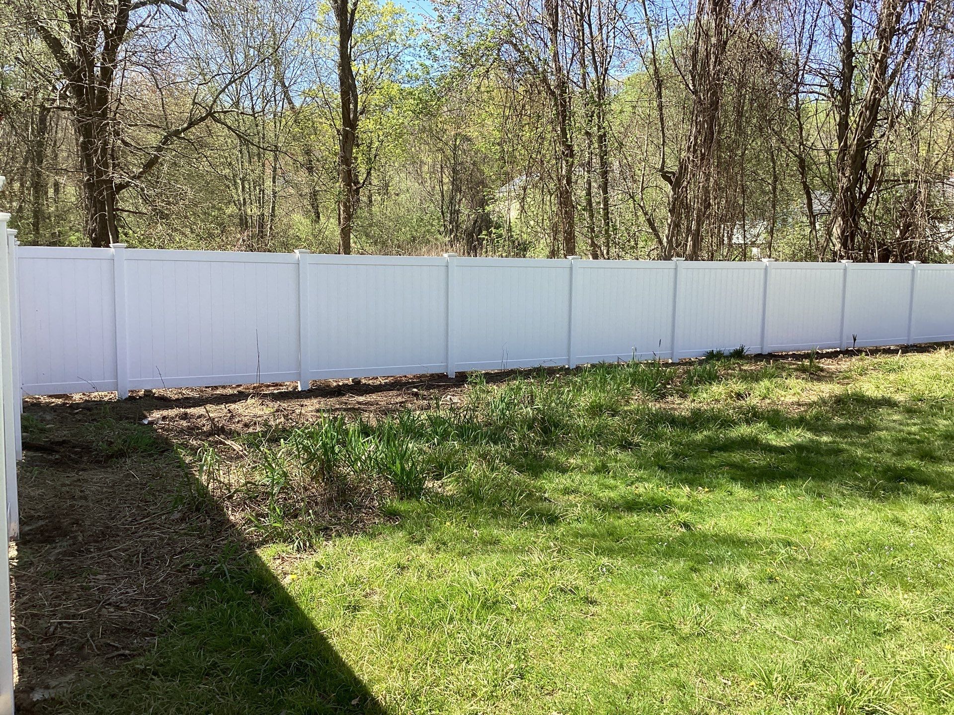 New White Vinyl privacy fence with matching gates  by DiGiorgi Roofing and Siding Inc
