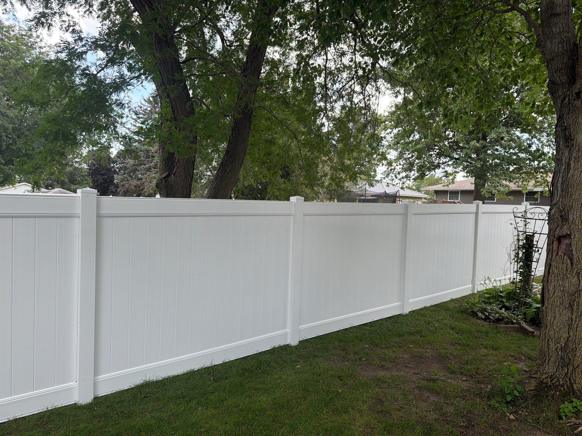 Residential White Vinyl Privacy and Black Chain Link Fencing in Jesup by Perfect Picket Fence and Stain