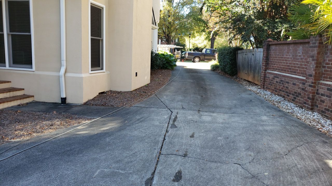 Driveway Clean using cleaner by Power Wash Masters LLC